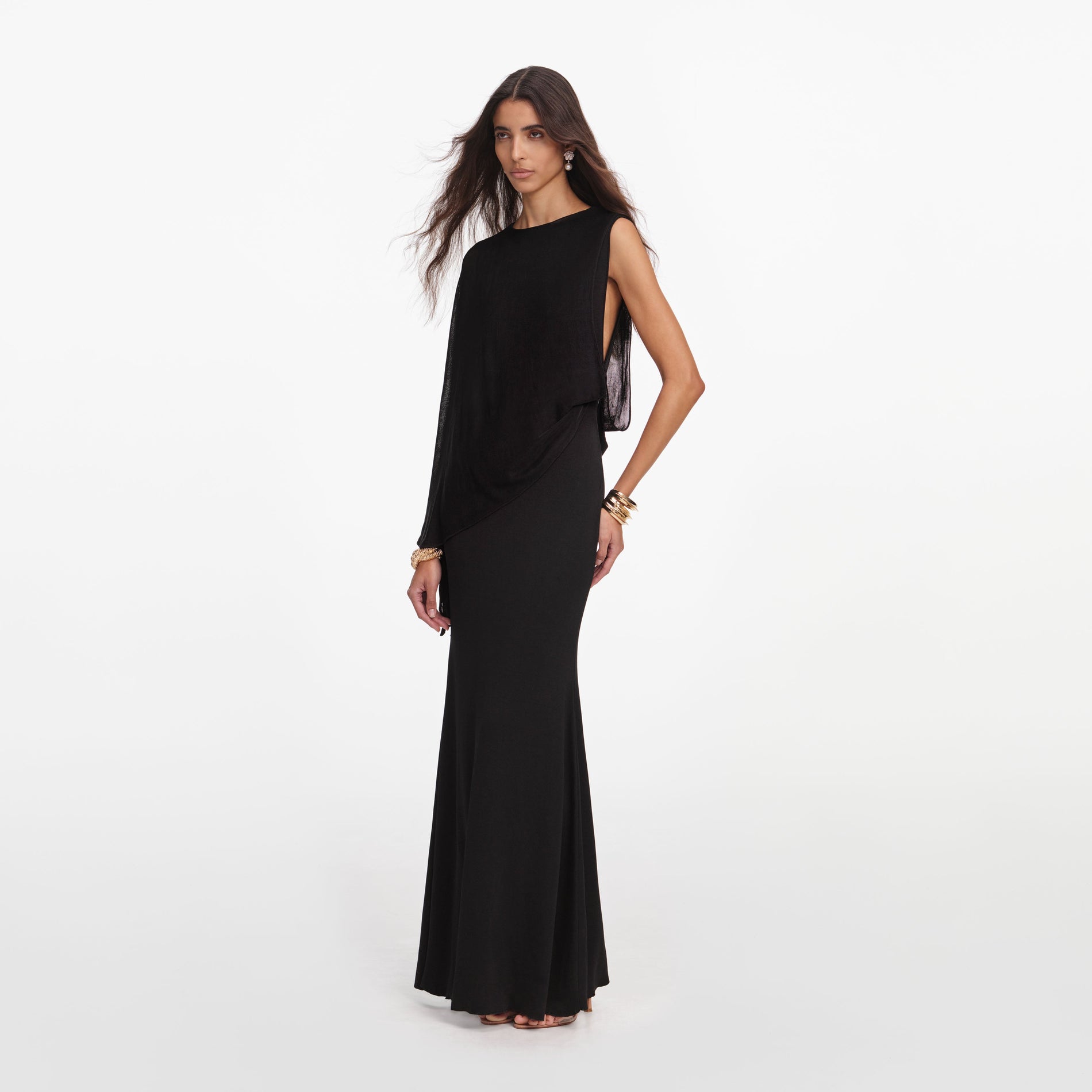 Side view of a woman wearing the Black Viscose Knit One Shoulder Maxi Dress