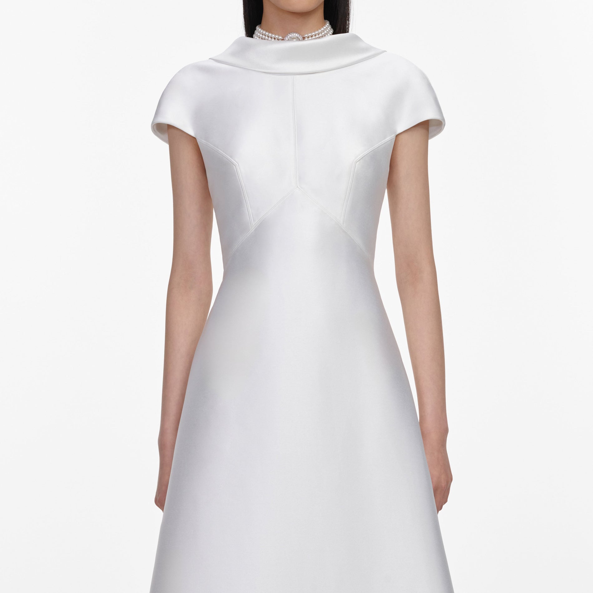 A close up of a woman wearing the White Taffeta Collared Maxi Dress