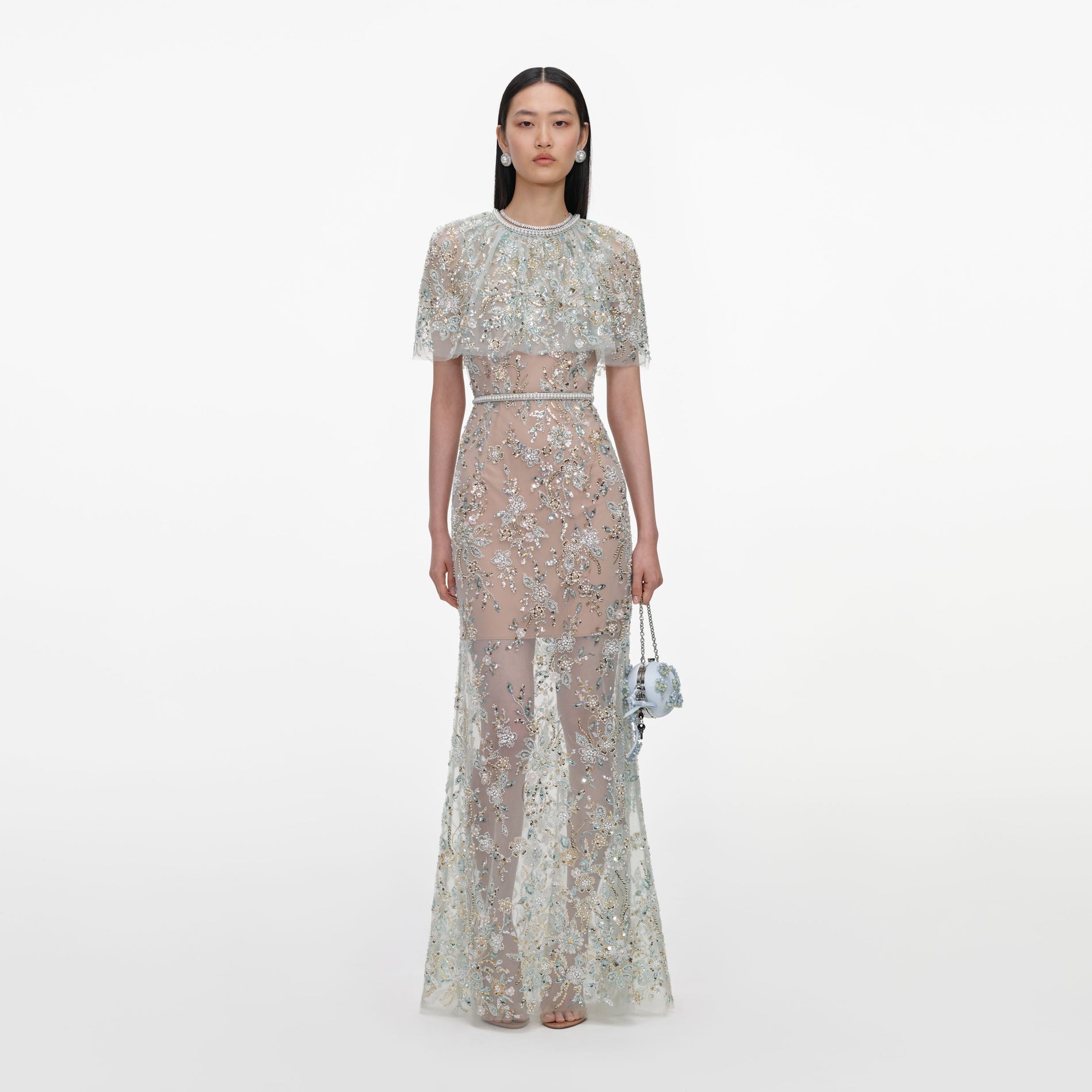 Front view of a woman wearing the Mint Embellished Cape Maxi Dress