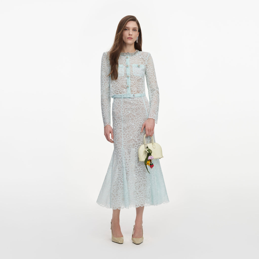 Front view of a woman wearing the Mint Lace Midi Skirt