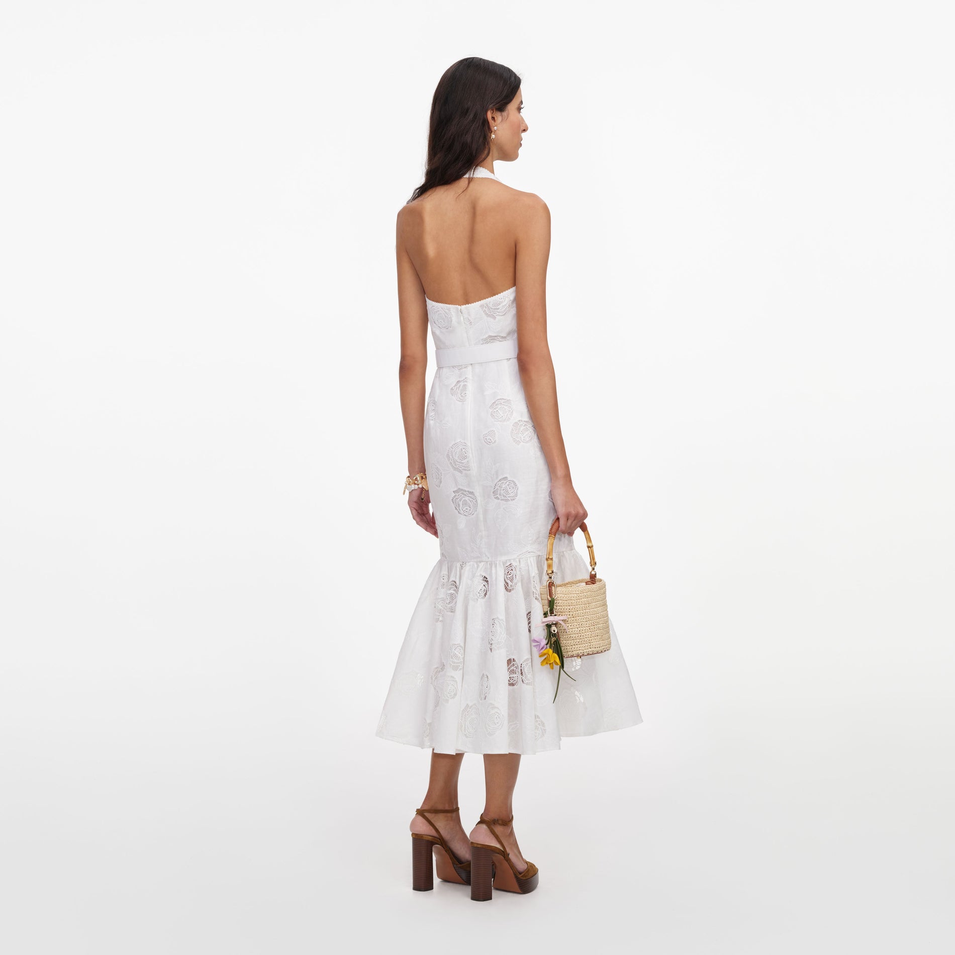 Back view of a woman wearing the White Linen Blend Halterneck Midi Dress