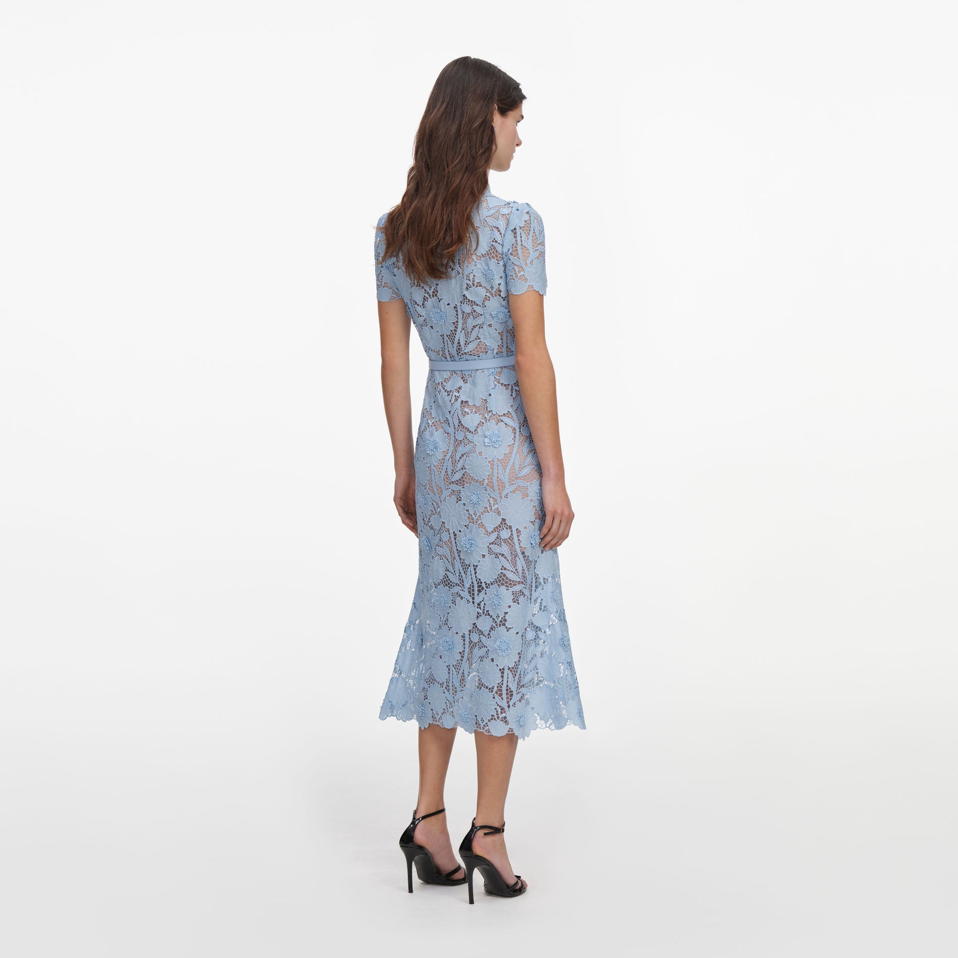 Back view of a woman wearing the Blue Lace Tie Neck Midi Dress