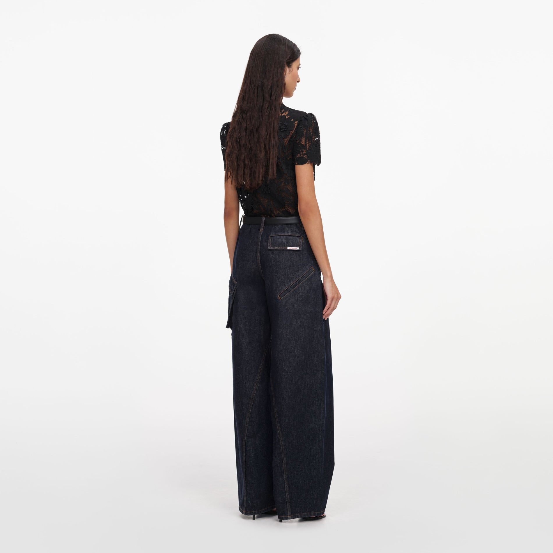 Back view of a woman wearing the Black Lace Tie Neck Top