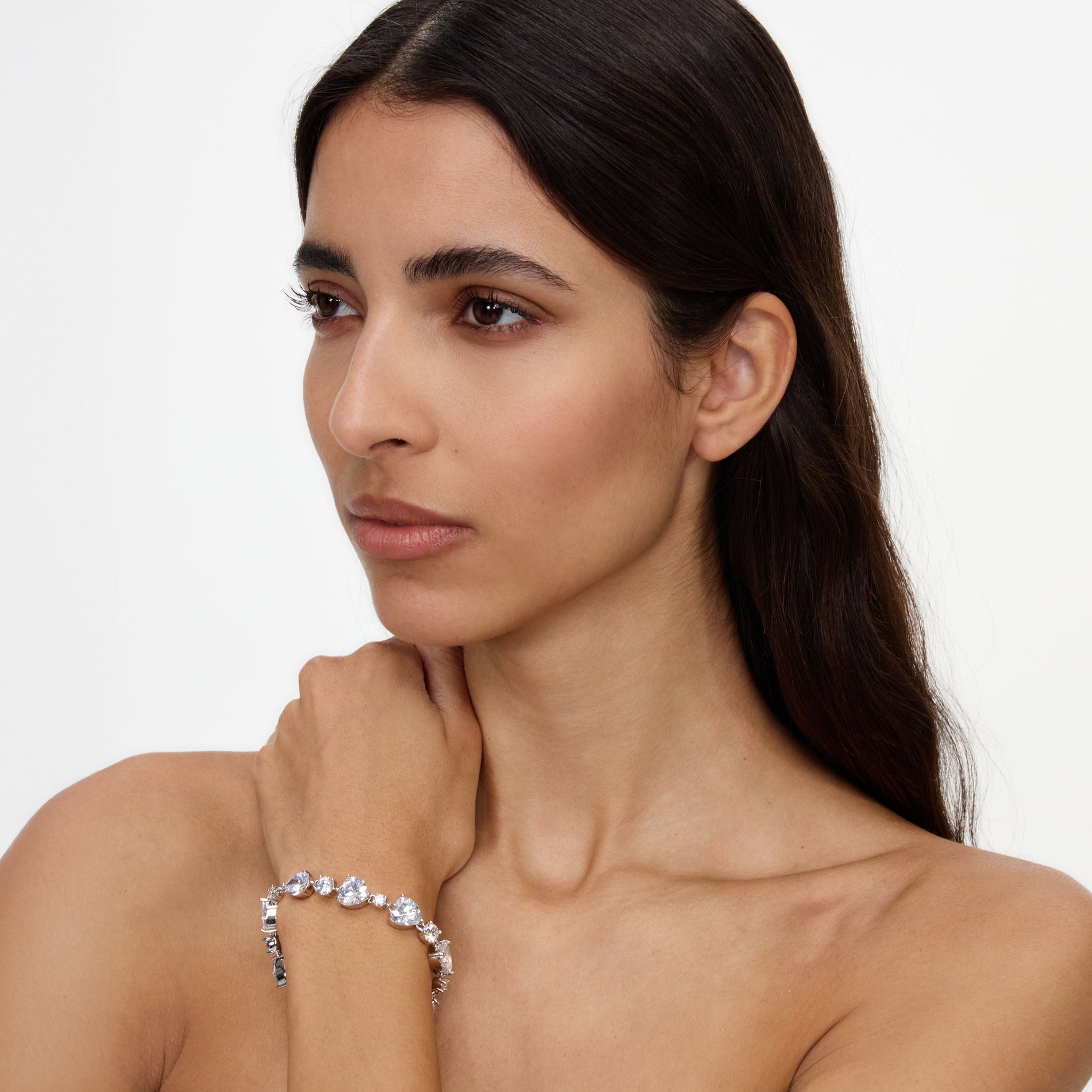 A close up of a woman wearing the Crystal Droplet Bracelet