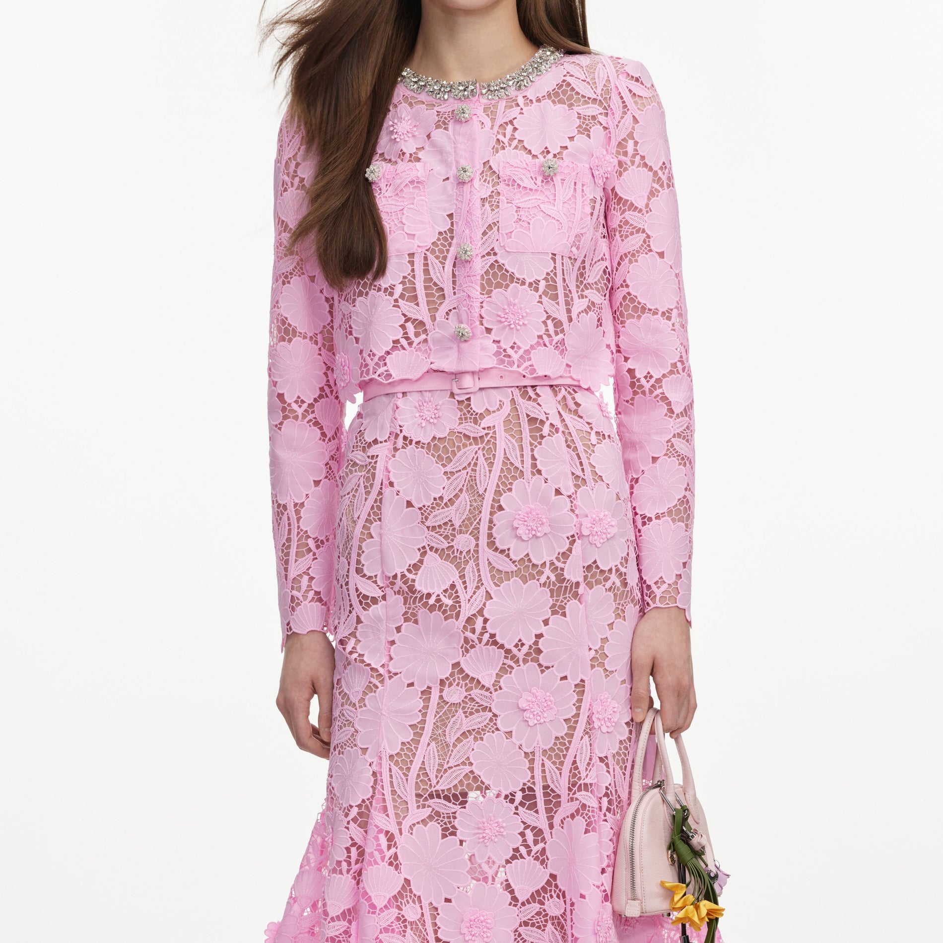 A close up of a woman wearing the Pink Lace Crystal Embellished Midi Dress