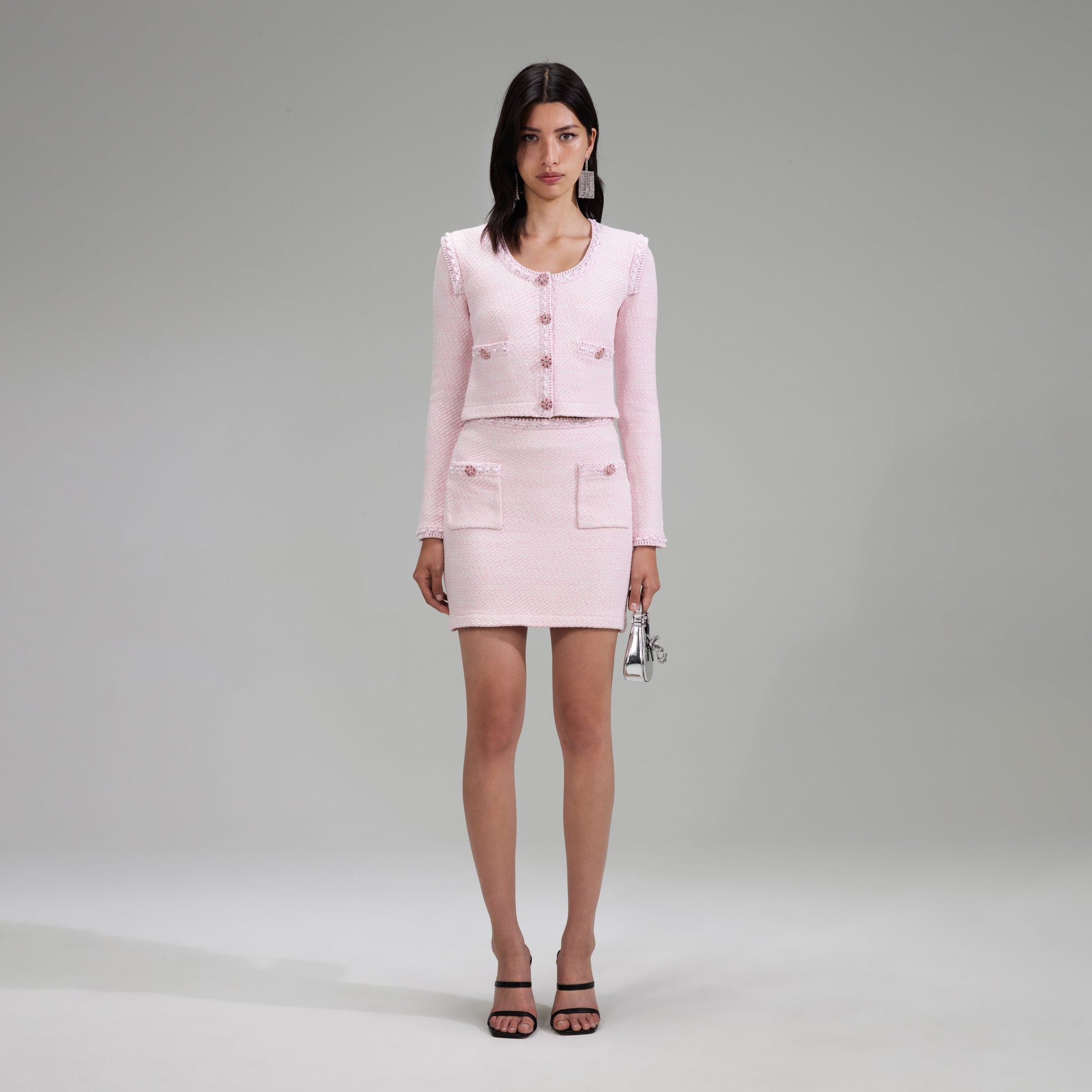 A woman wearing the Pink Knit Mini Skirt