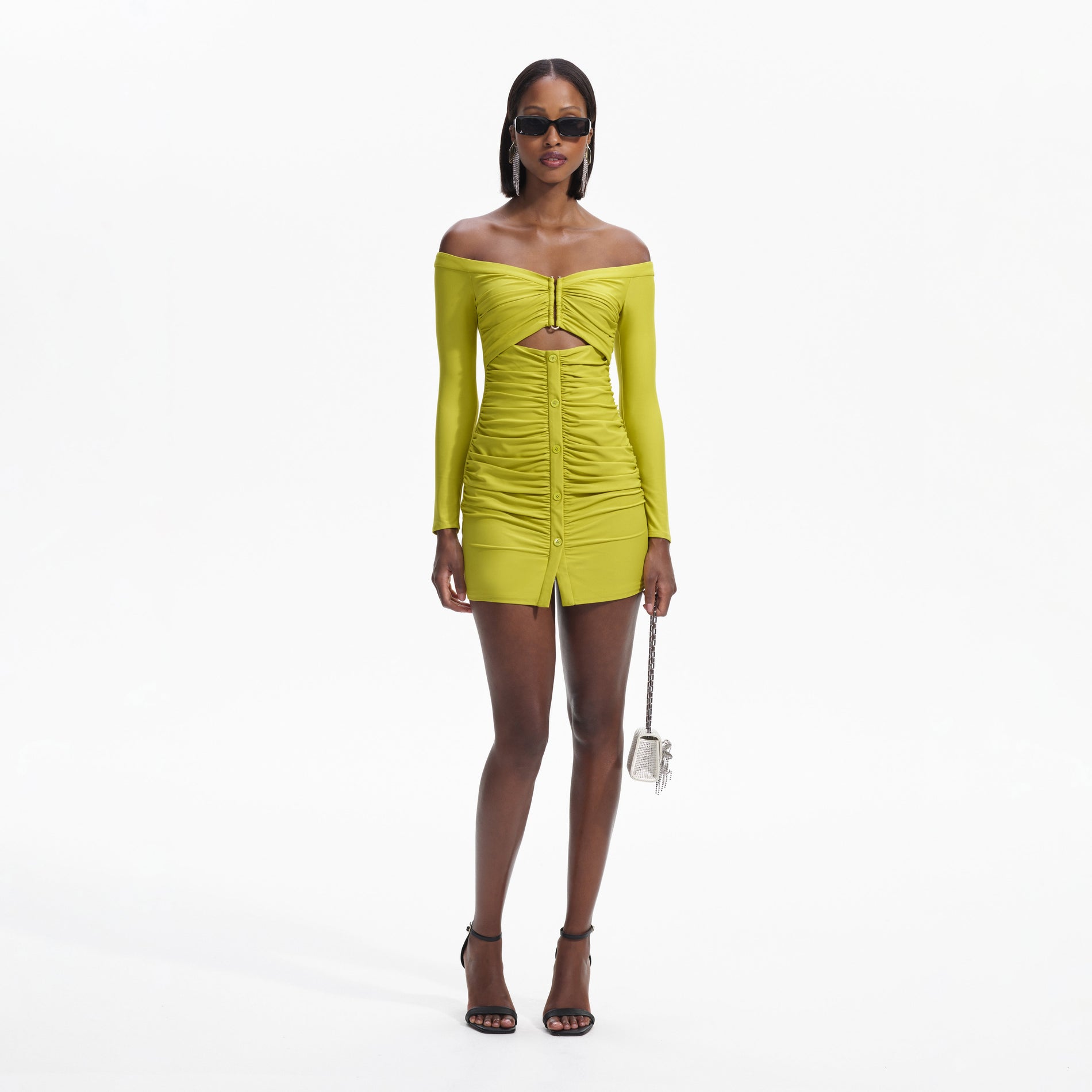 Front view of a woman wearing the Chartreuse Off Shoulder Mini Dress