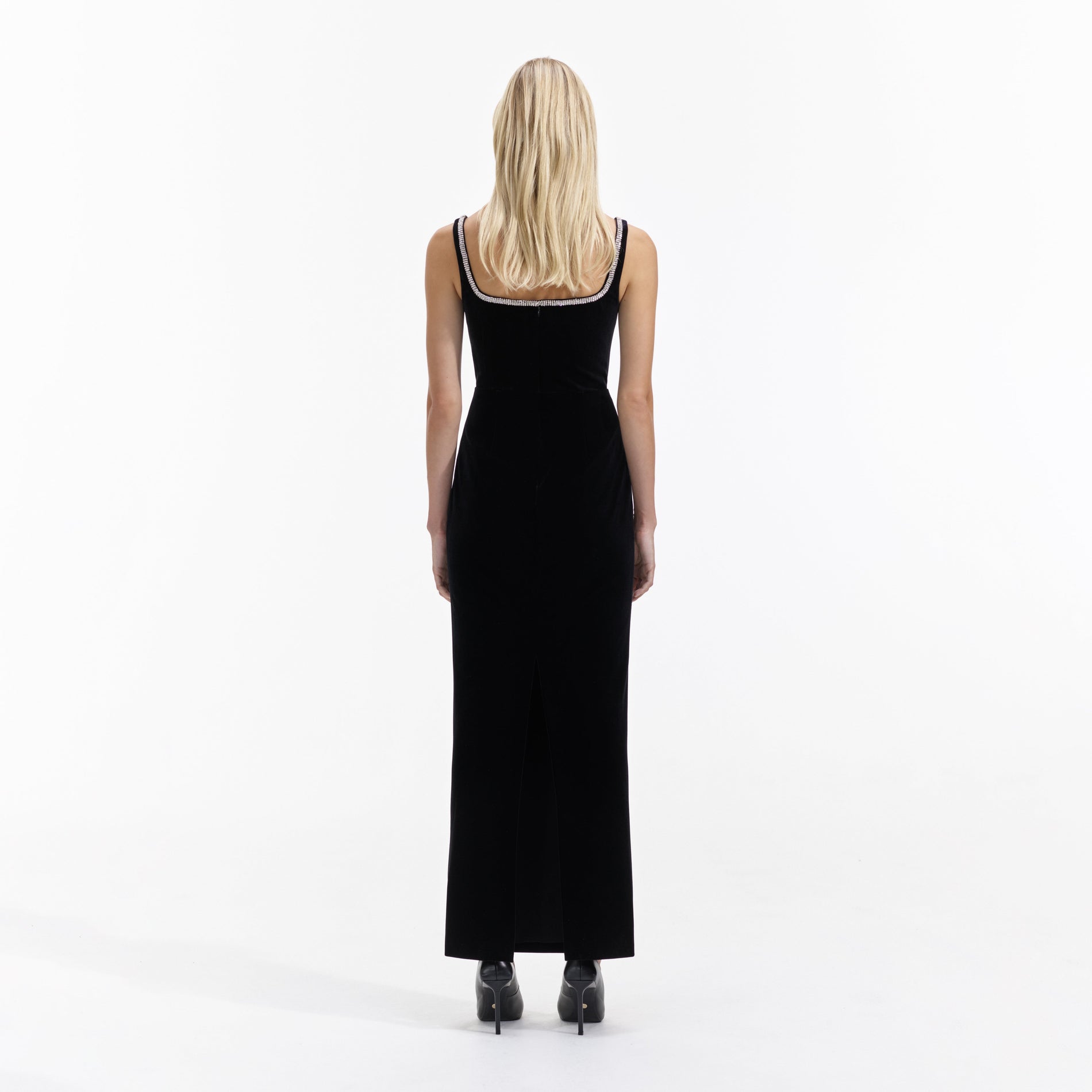 Back view of a woman wearing the Black Velvet Maxi Dress
