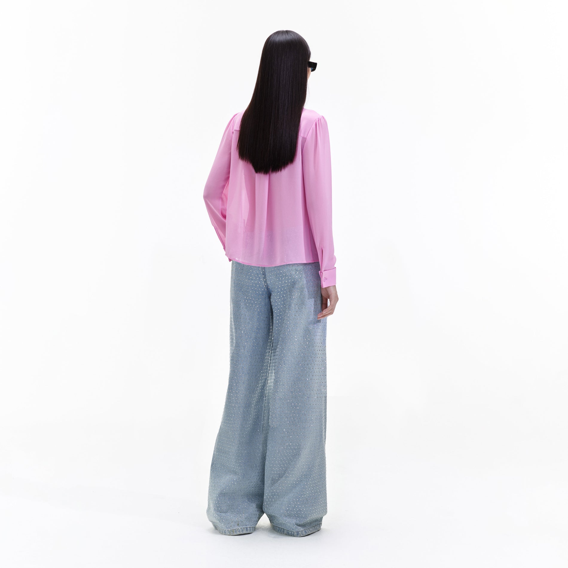 Back view of a woman wearing the Pink Chiffon Blouse
