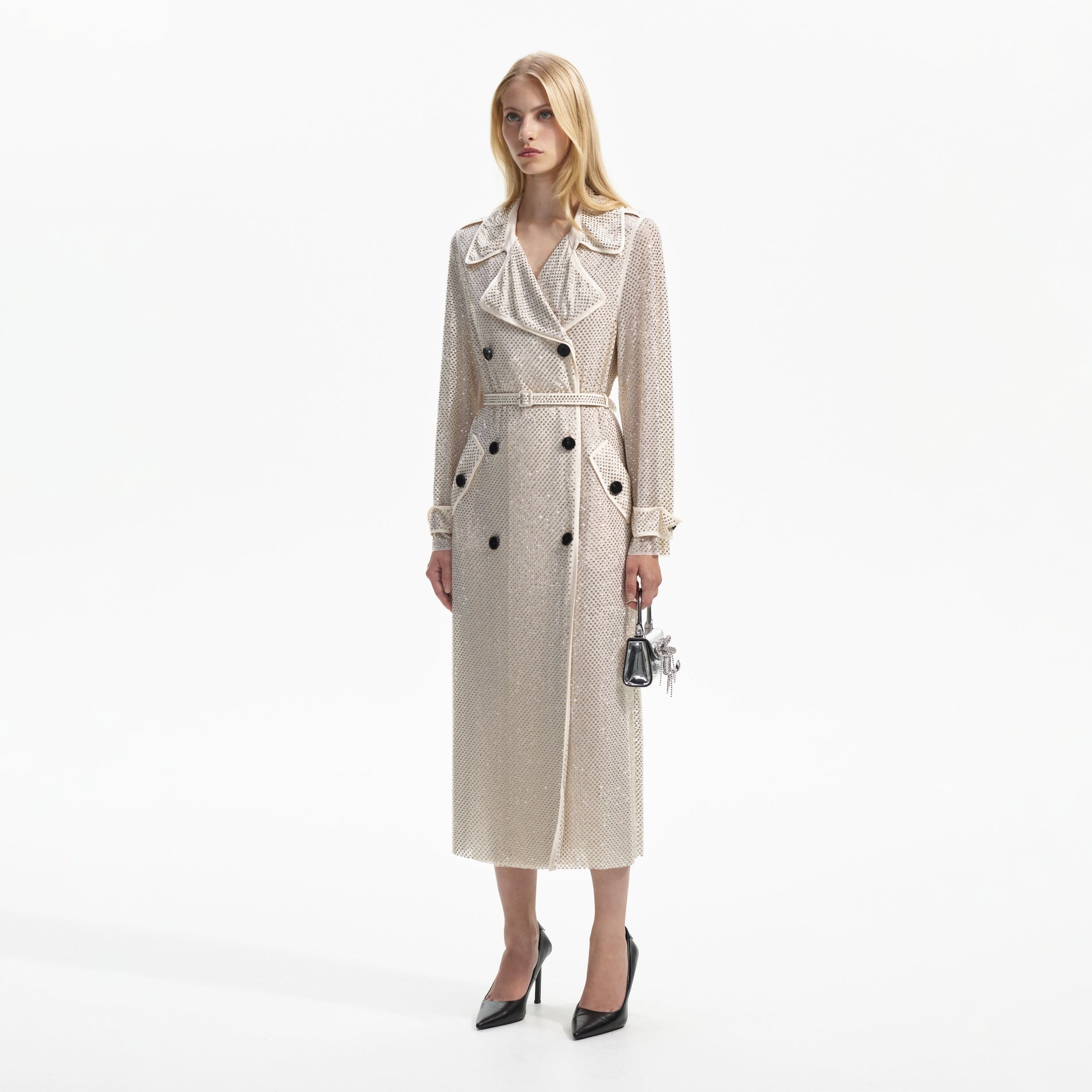 Side view of a woman wearing the Cream Rhinestone Trench