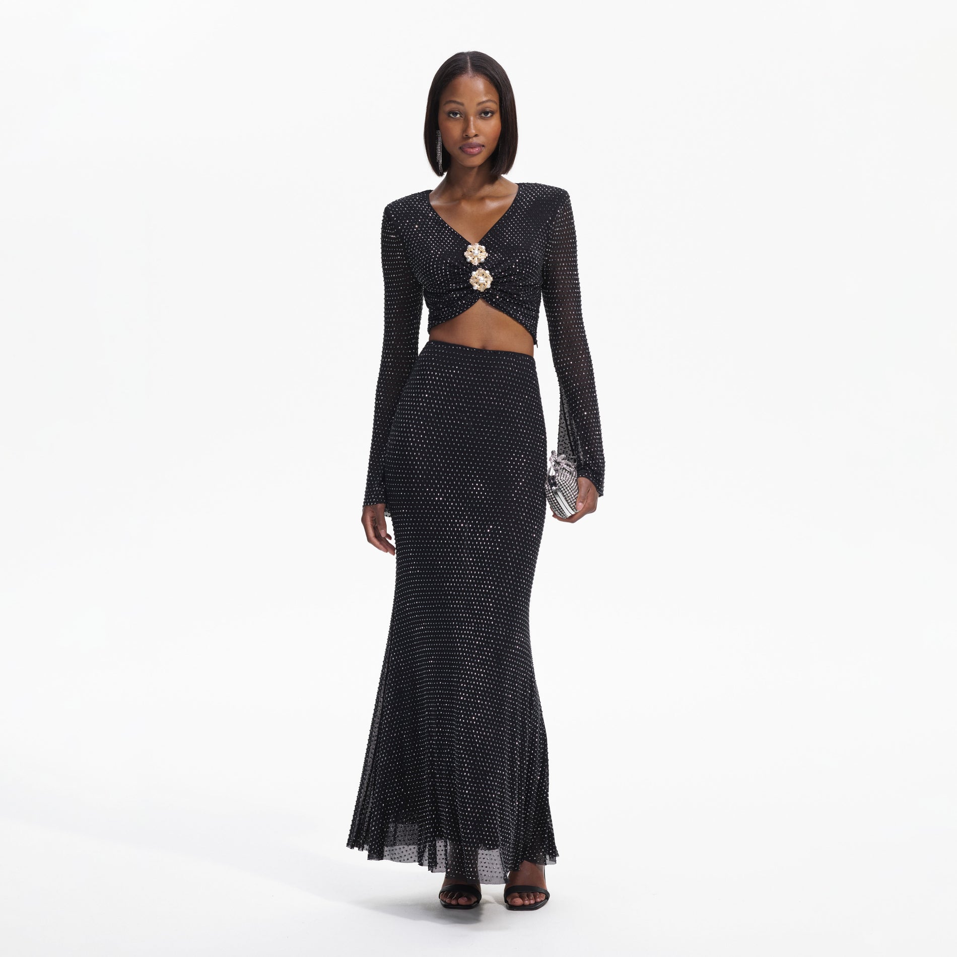 Front view of a woman wearing the Black Rhinestone Maxi Skirt