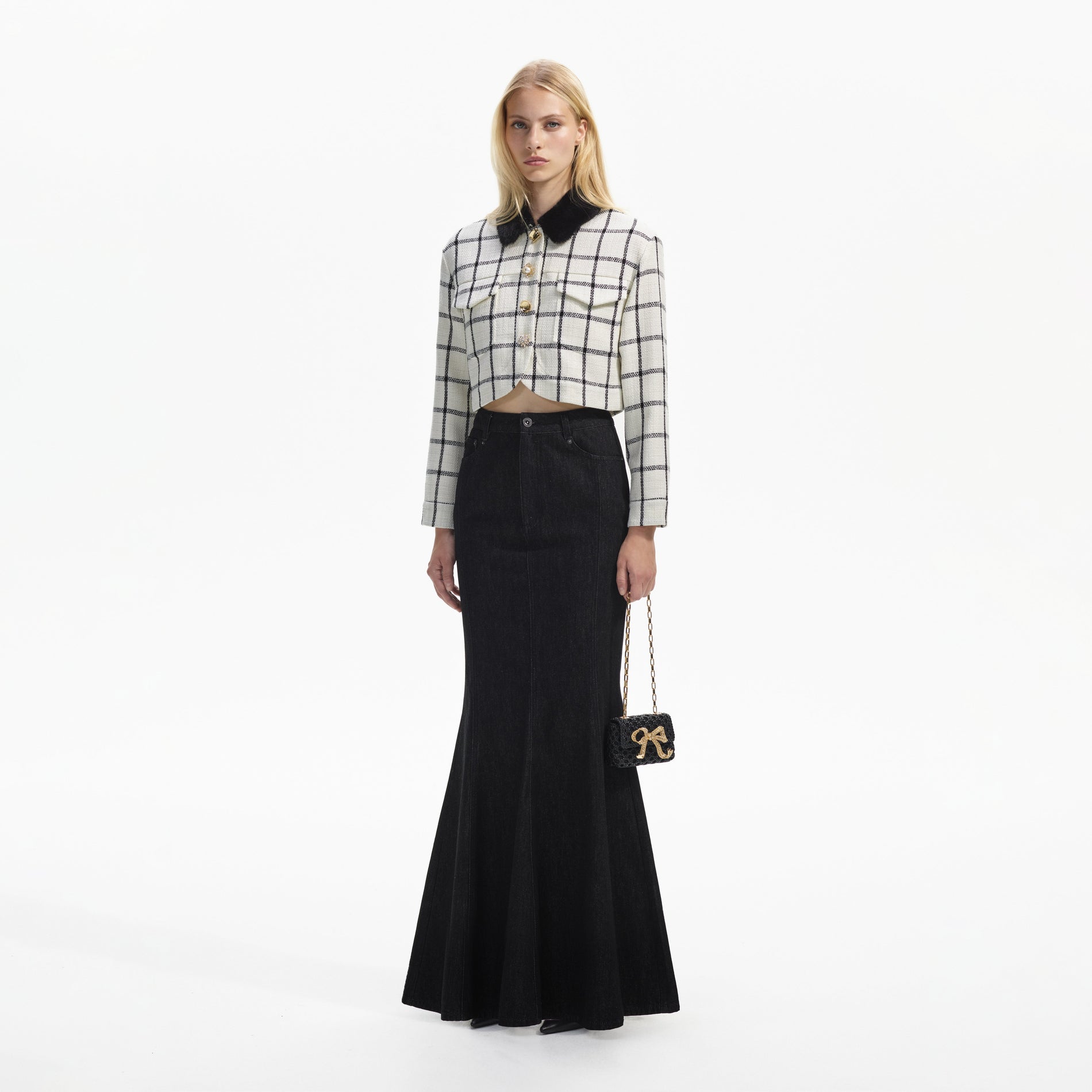 Side view of a woman wearing the Cream Check Boxy Jacket