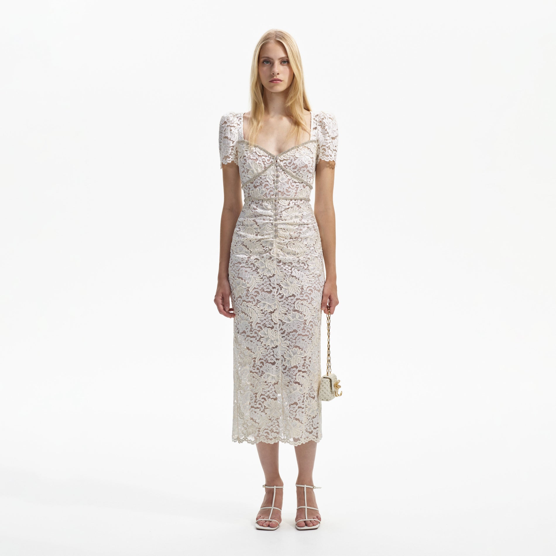Front view of a woman wearing the Cream Cord Lace Midi Dress
