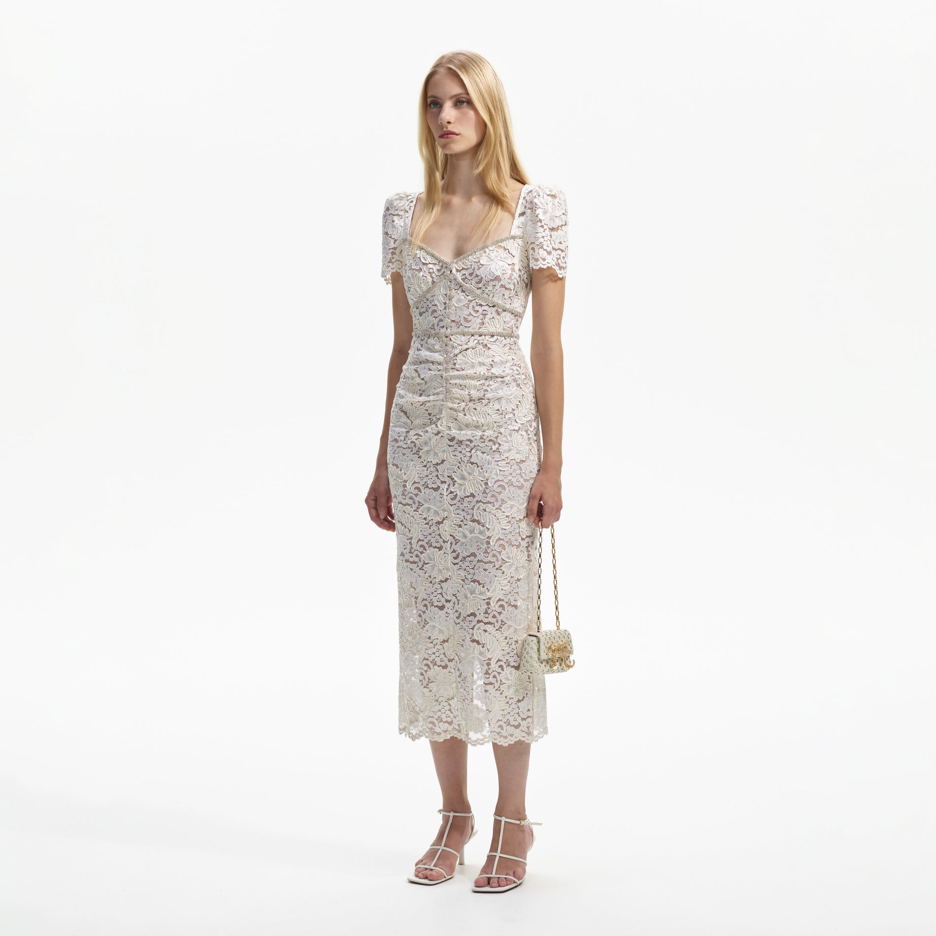 Side view of a woman wearing the Cream Cord Lace Midi Dress