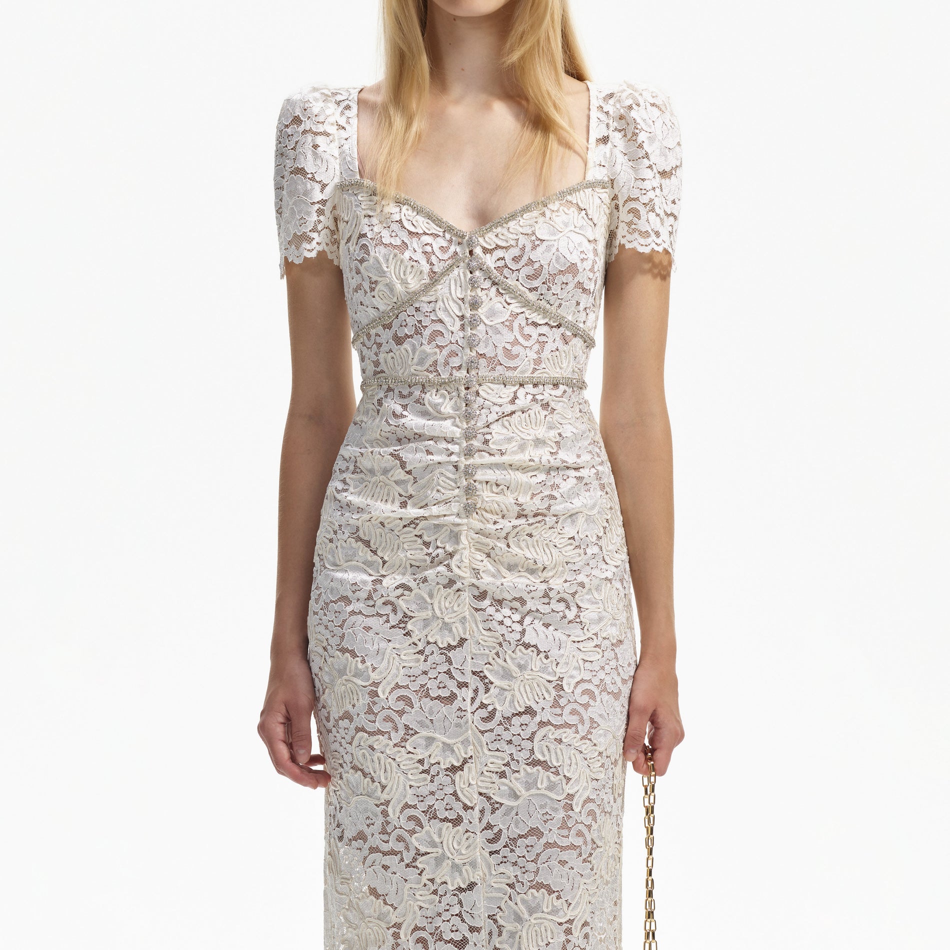 A close up of a woman wearing the Cream Cord Lace Midi Dress