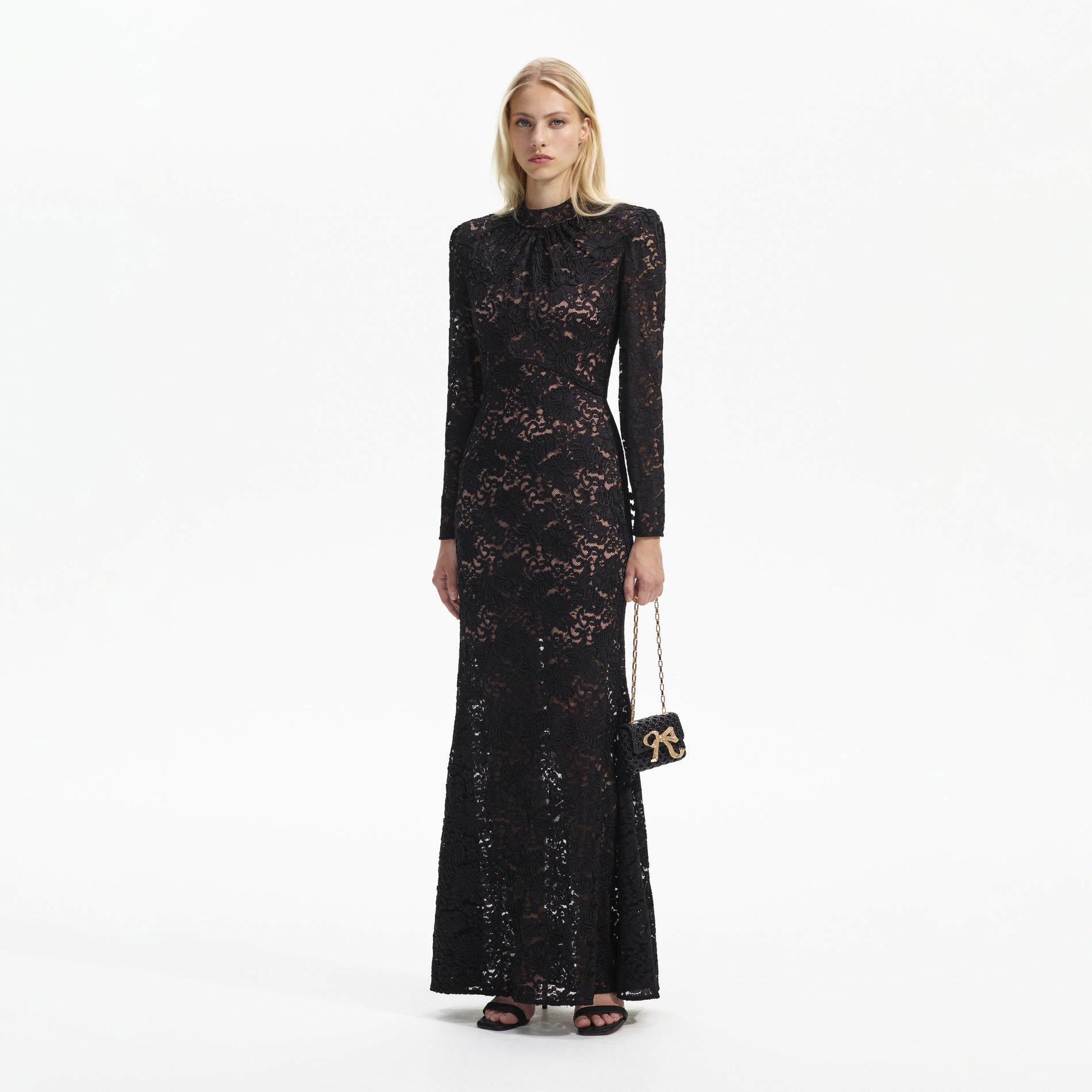 Side view of a woman wearing the Black Cord Lace Maxi Dress