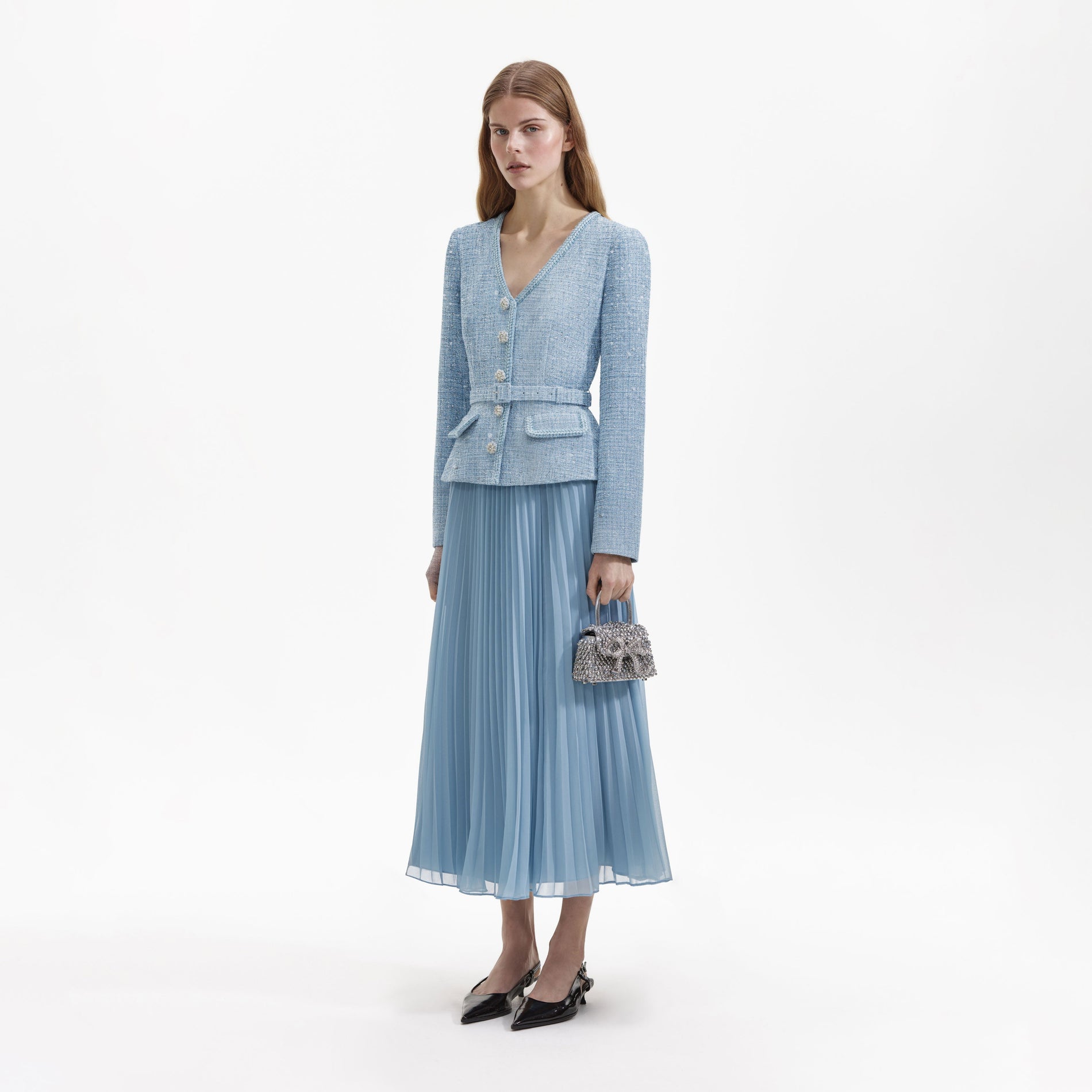 Side view of a woman wearing the Blue Boucle Tailored Midi Dress