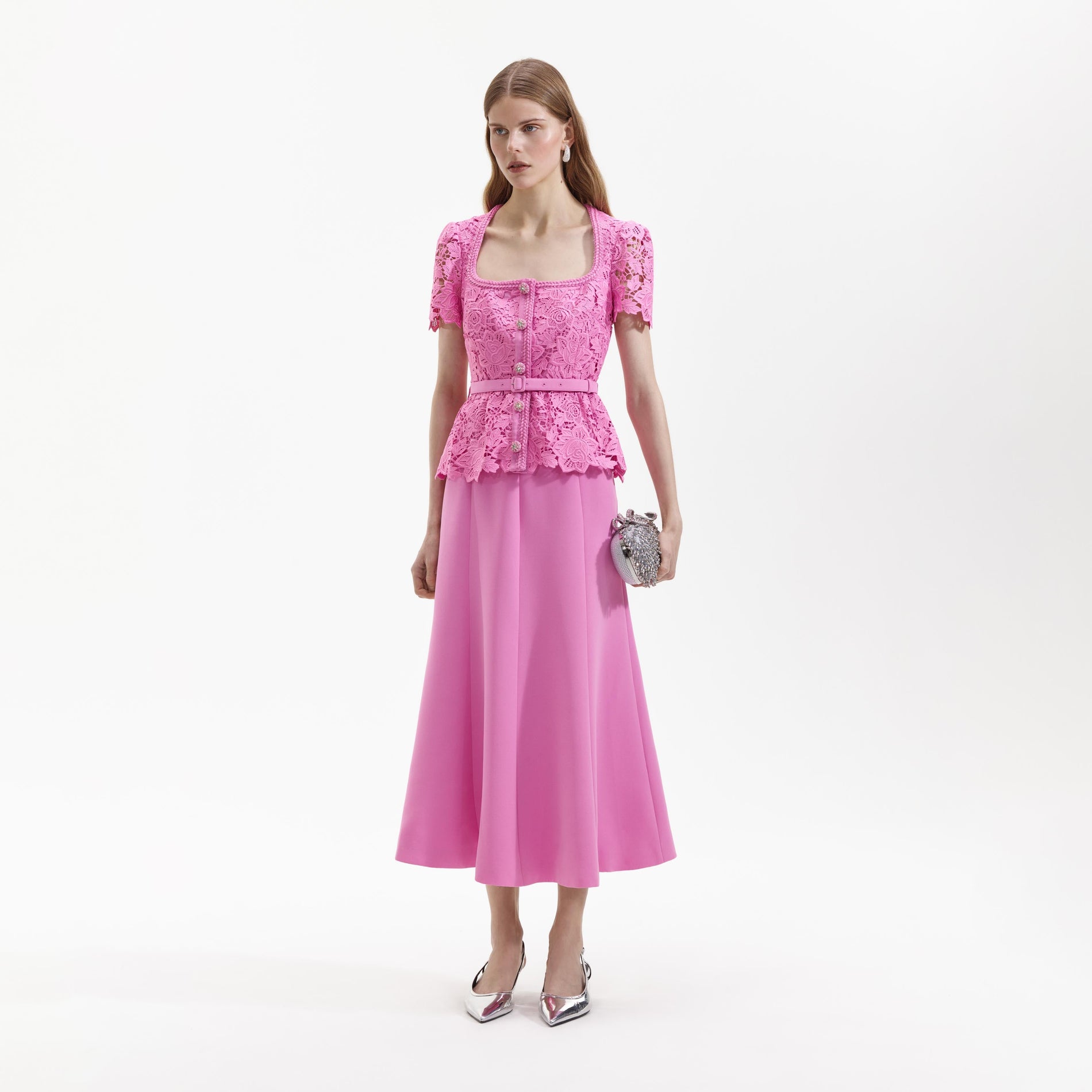 Side view of a woman wearing the Pink Lace Tailored Midi Dress