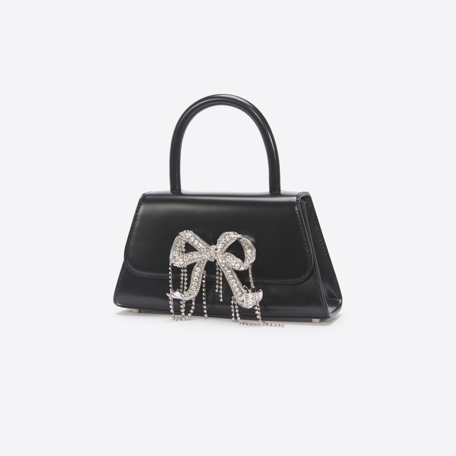 Back view of a woman wearing the Black Leather Mini Bow Bag