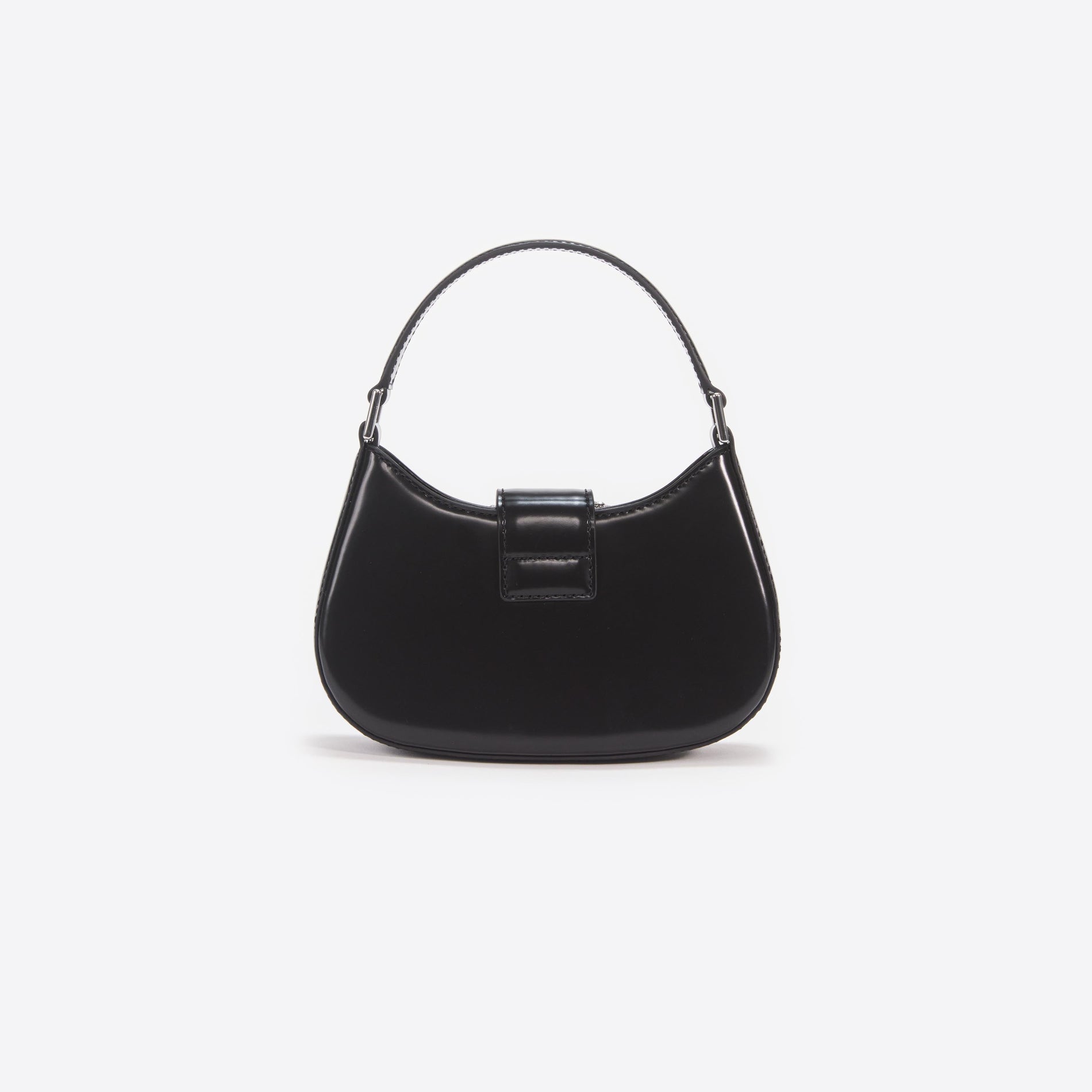 Side view of a woman wearing the Black Leather Crescent Bag