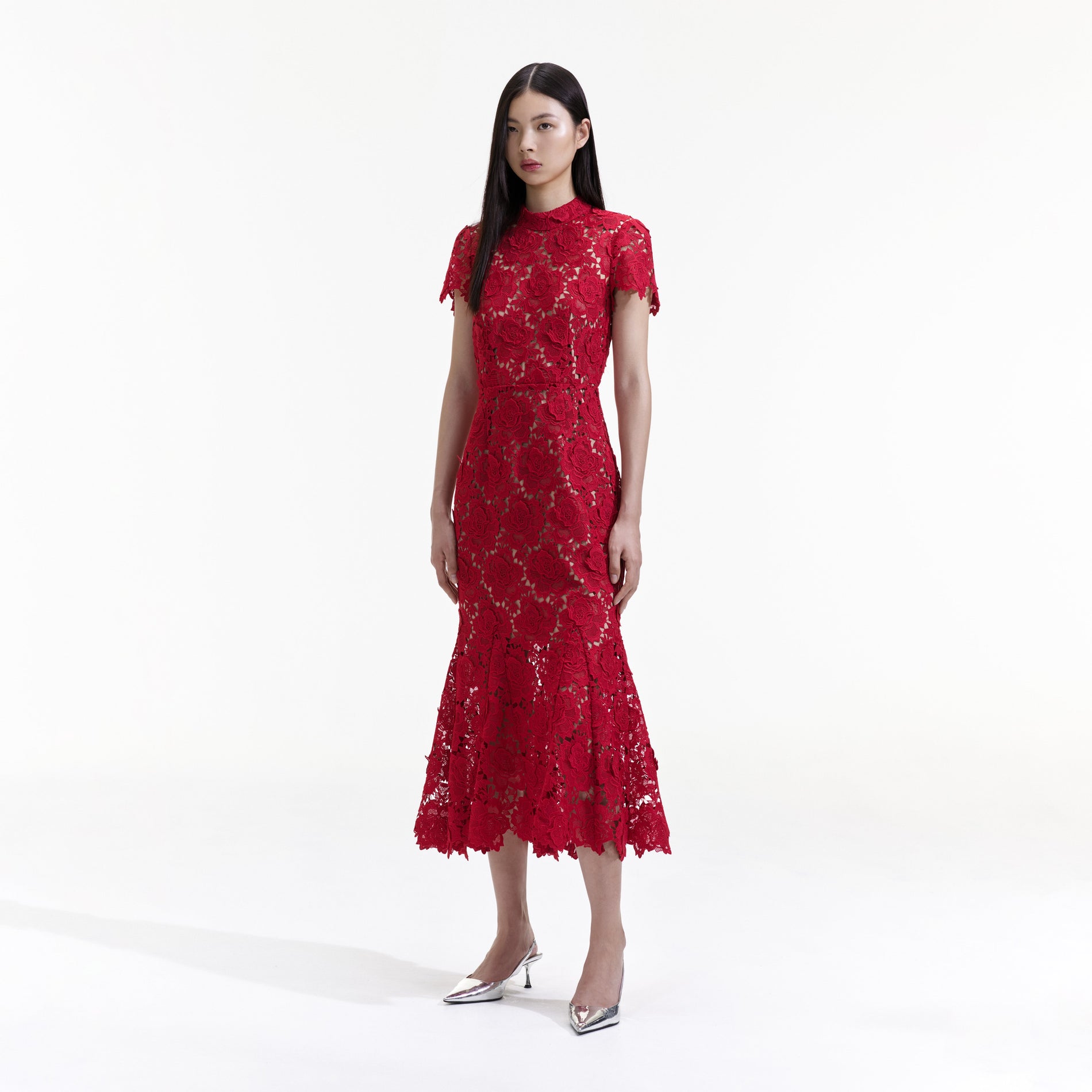Side view of a woman wearing the Red Flower Lace Midi Dress