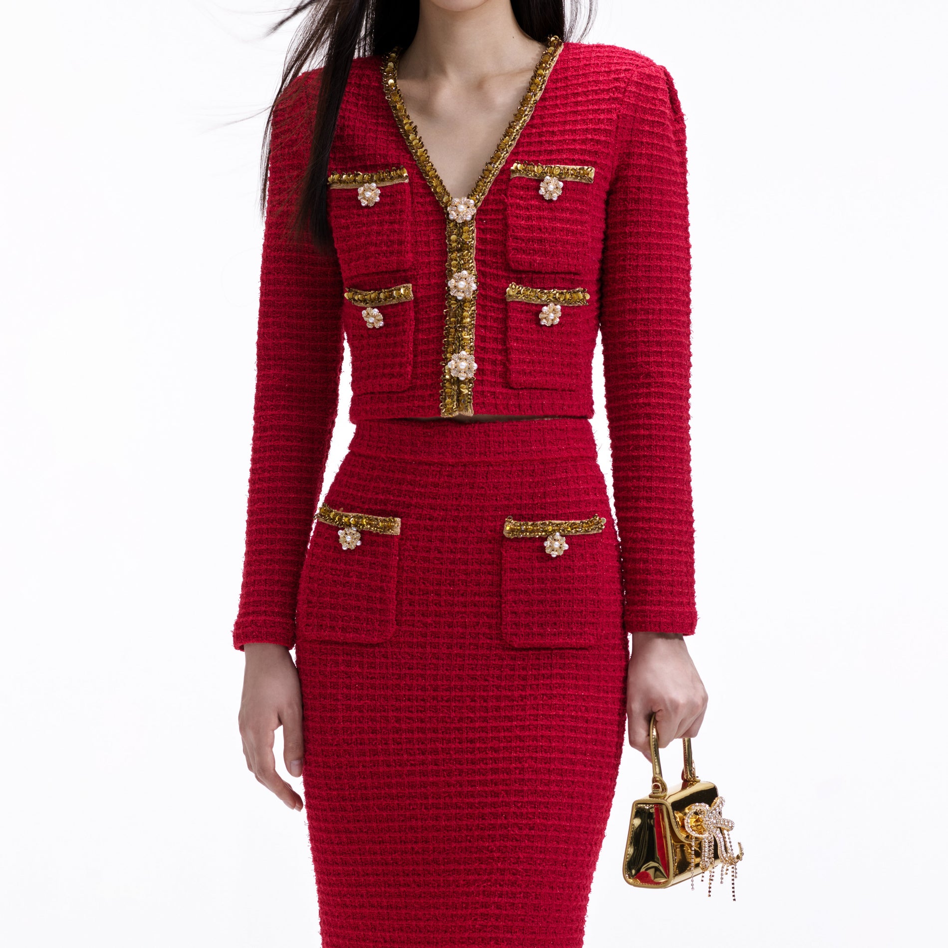 A close up of a woman wearing the Red Knit Midi Skirt