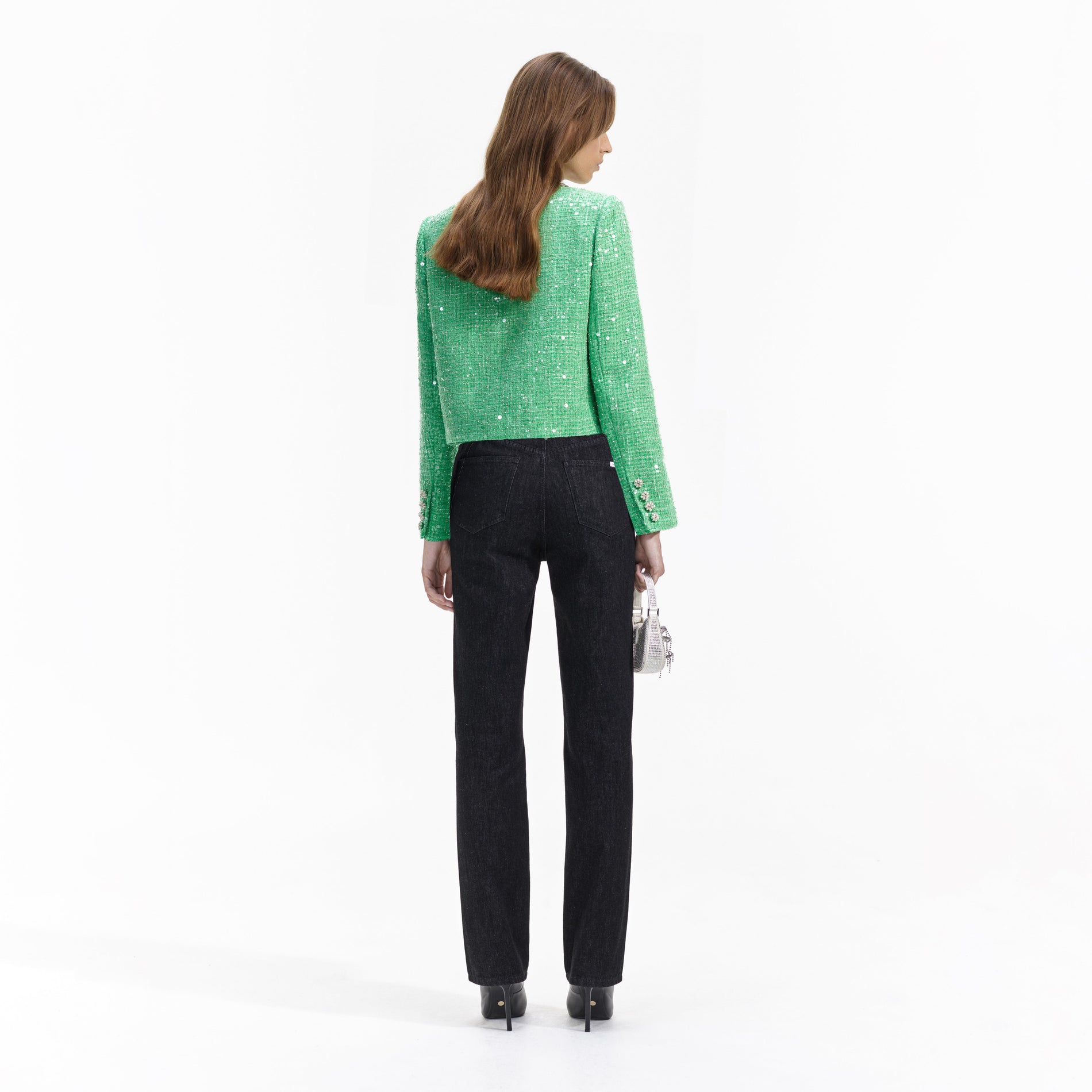 Back view of a woman wearing the Green Boucle Jacket