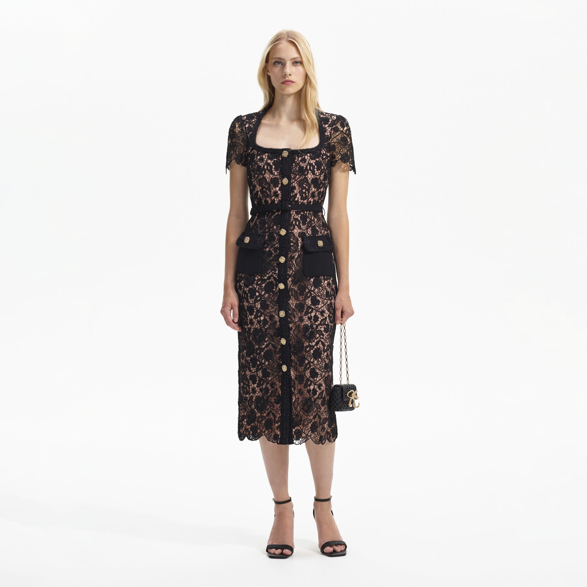 Front view of a woman wearing the Black Guipure Lace Short Sleeve Midi Dress