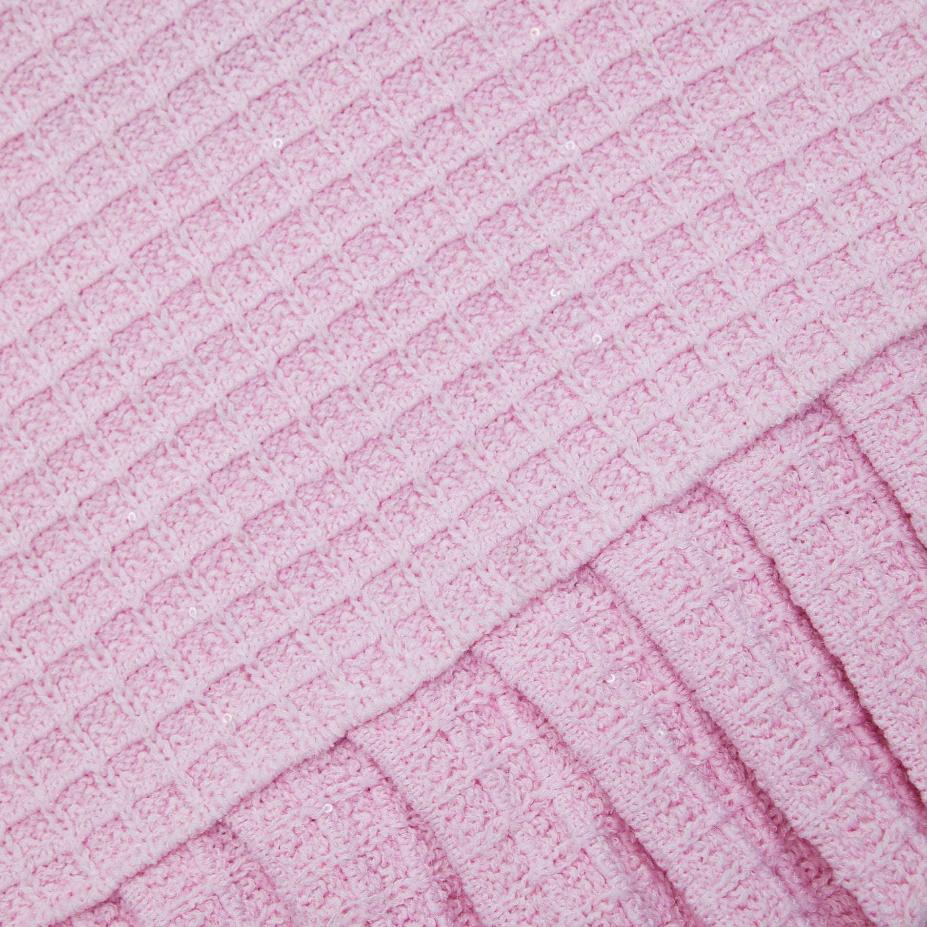 A close up of the fabric for the Pink Sequin Textured Knit Skirt