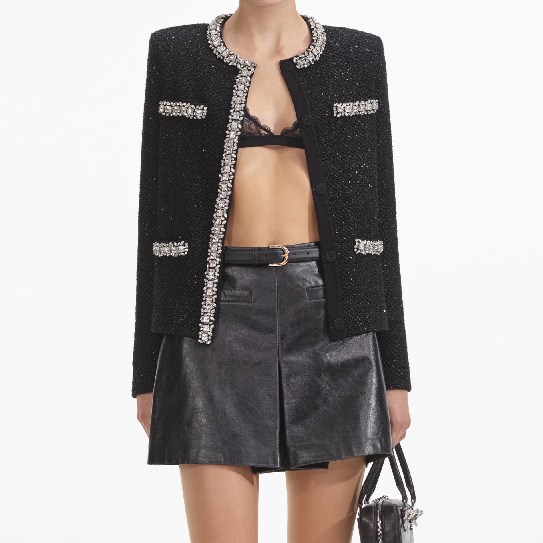 A close up of a woman wearing the Black Sequin Knit Cardigan