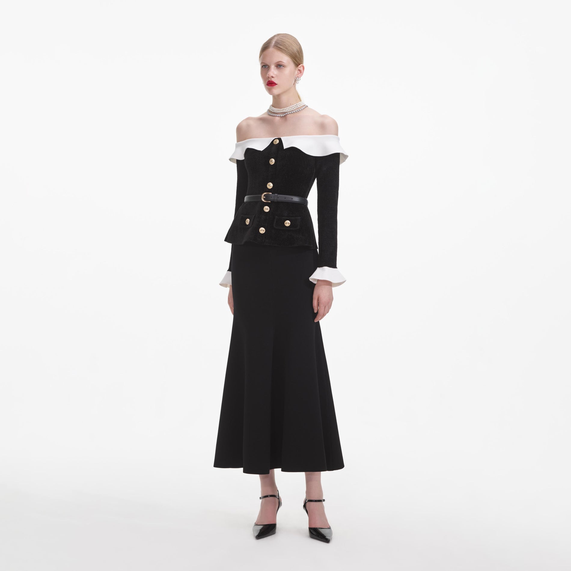 Side view of a woman wearing the Black Chenille Knit Off Shoulder Midi Dress