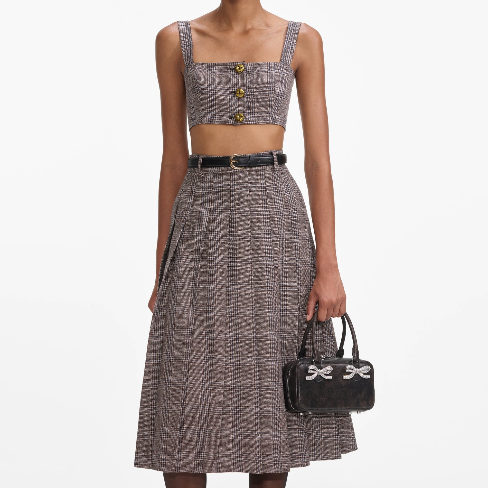 A close up of a woman wearing the Brown Check Crop Top