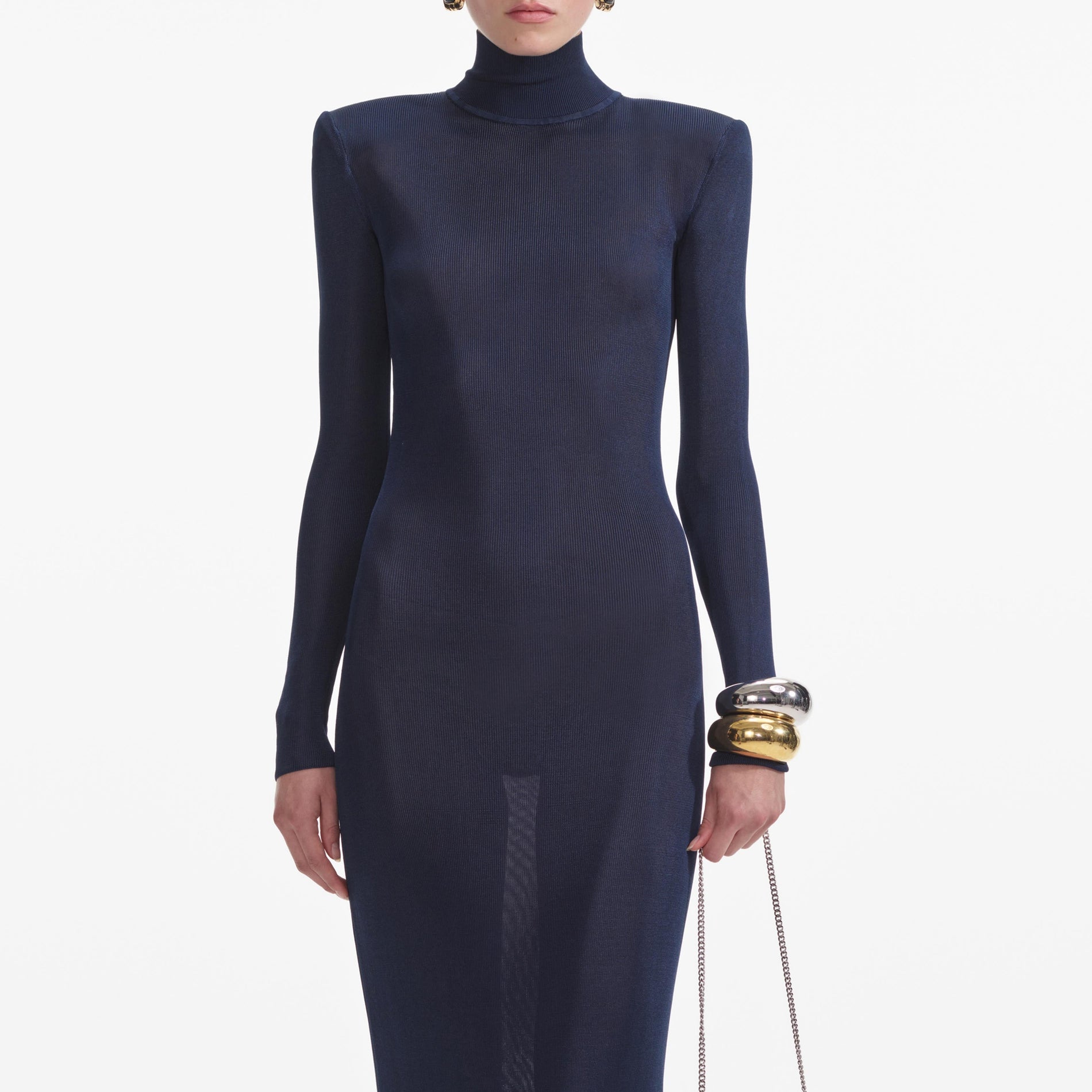 A close up of a woman wearing the Navy Viscose Knit Maxi Dress