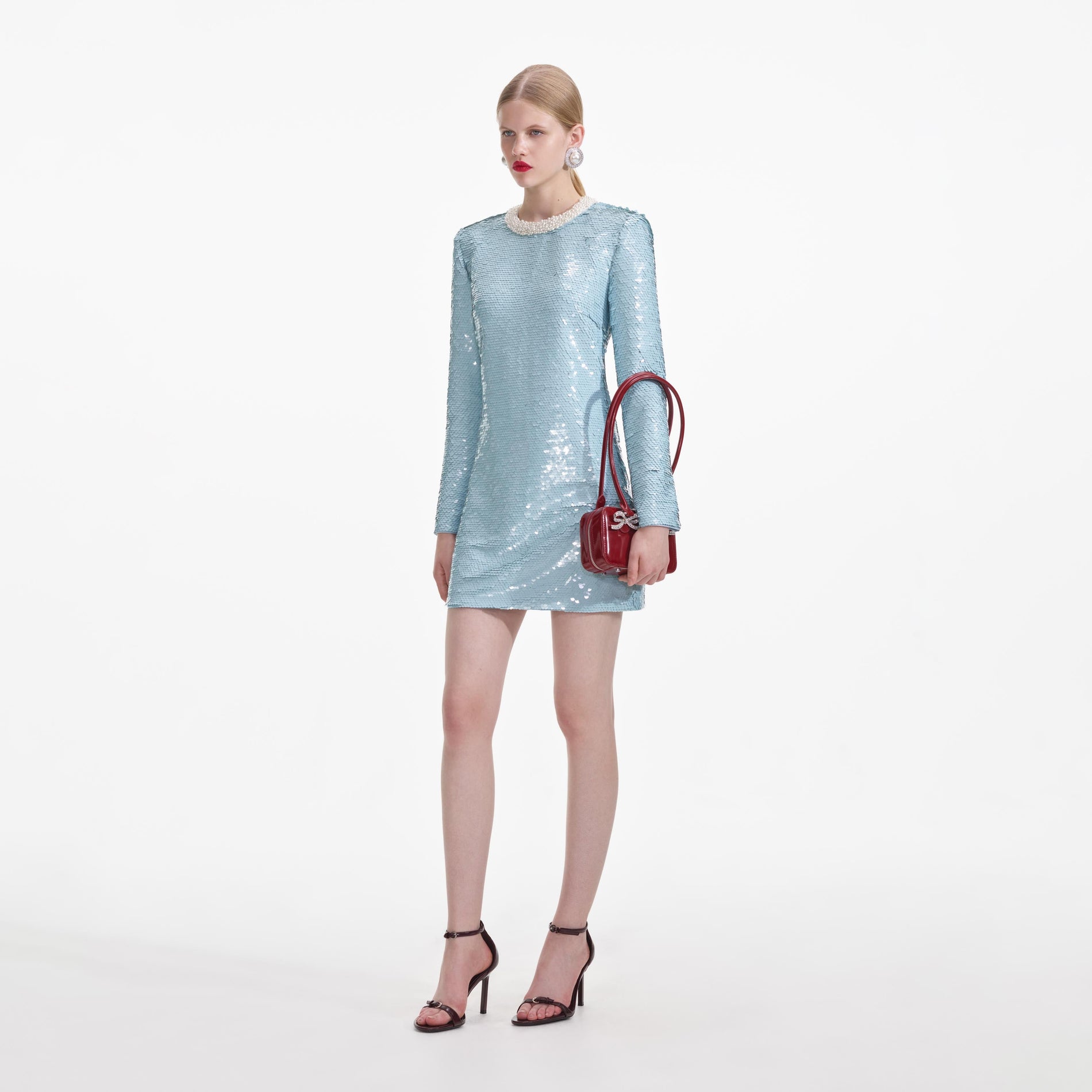 Side view of a woman wearing the Blue Sequin Mini Dress