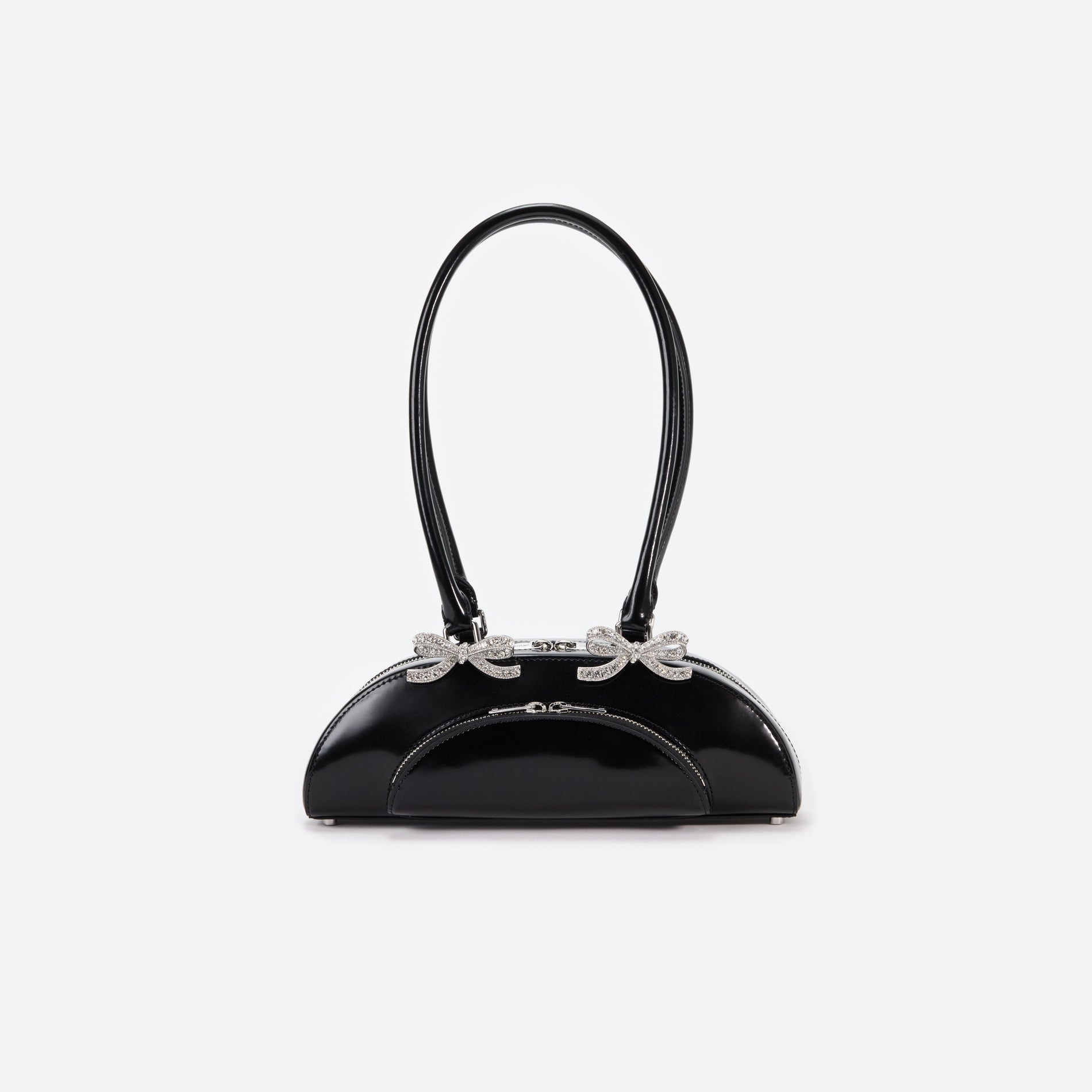 Front view of a woman wearing the Black Leather Curved Shoulder Bag