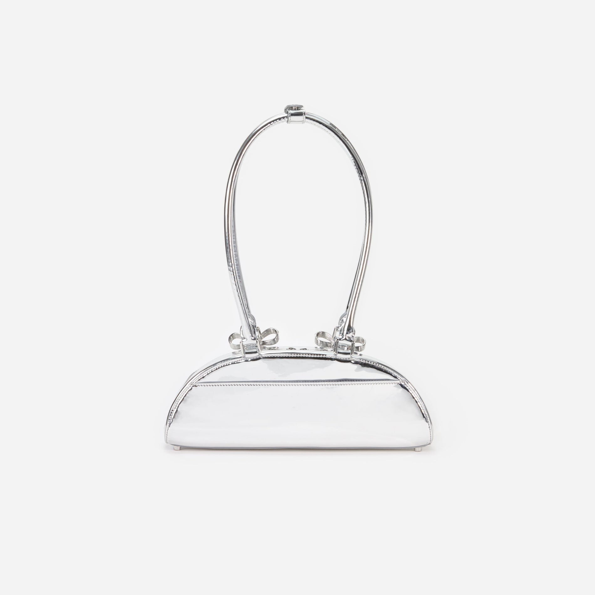 Back view of a woman wearing the Silver Metallic Curved Shoulder Bag