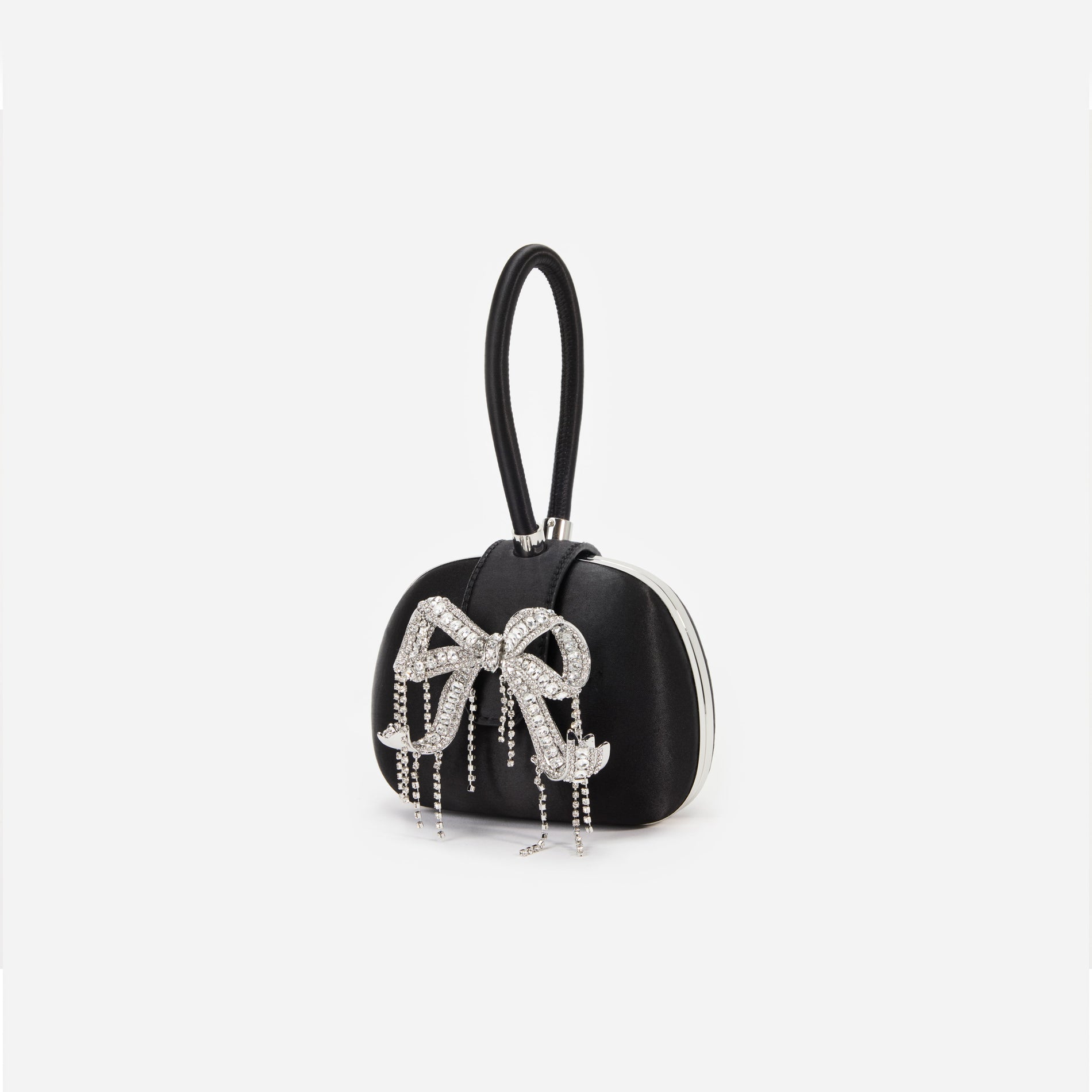 Side view of a woman wearing the Black Satin Top Handle Clutch Bag