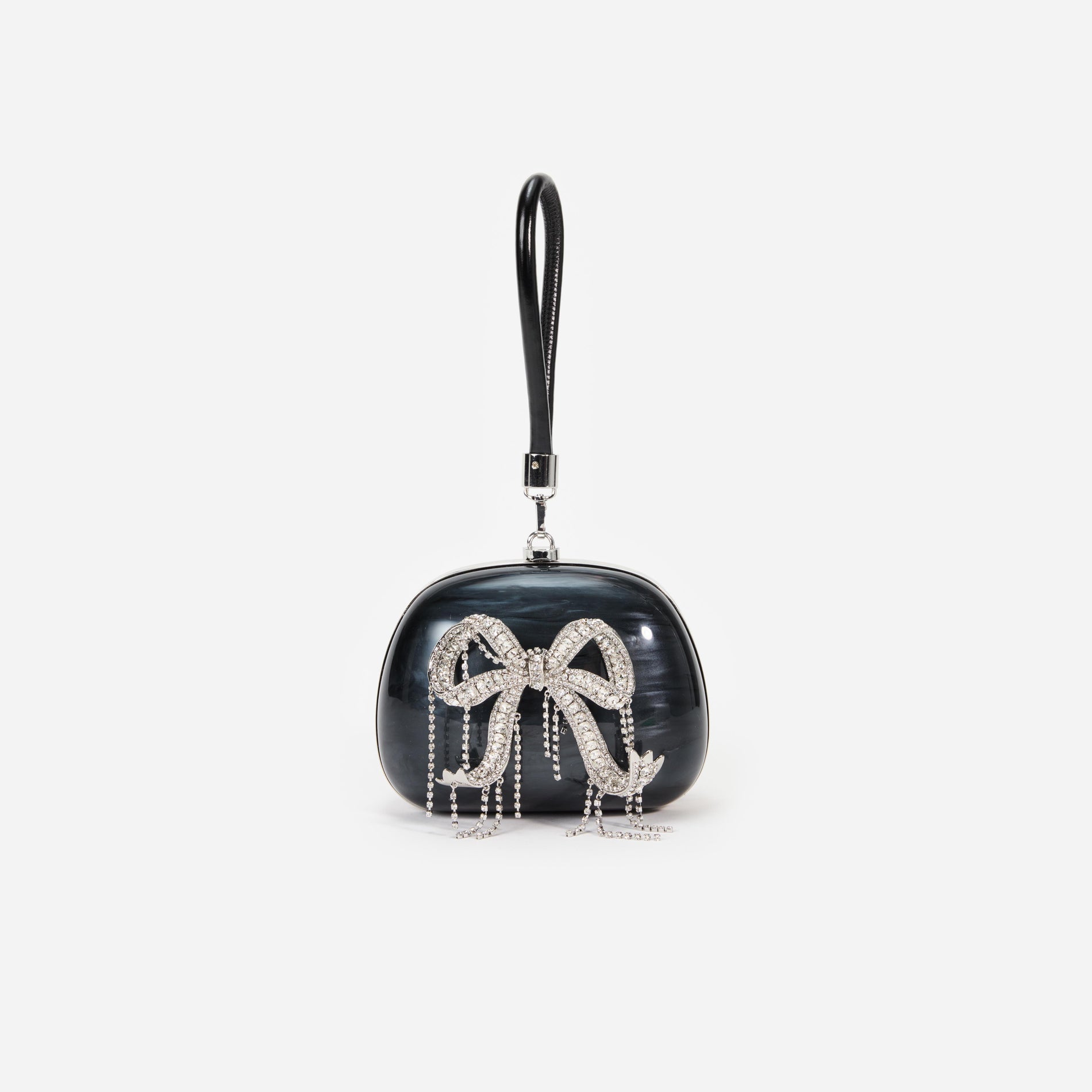 Front view of a woman wearing the Black Pearl Top Handle Clutch Bag