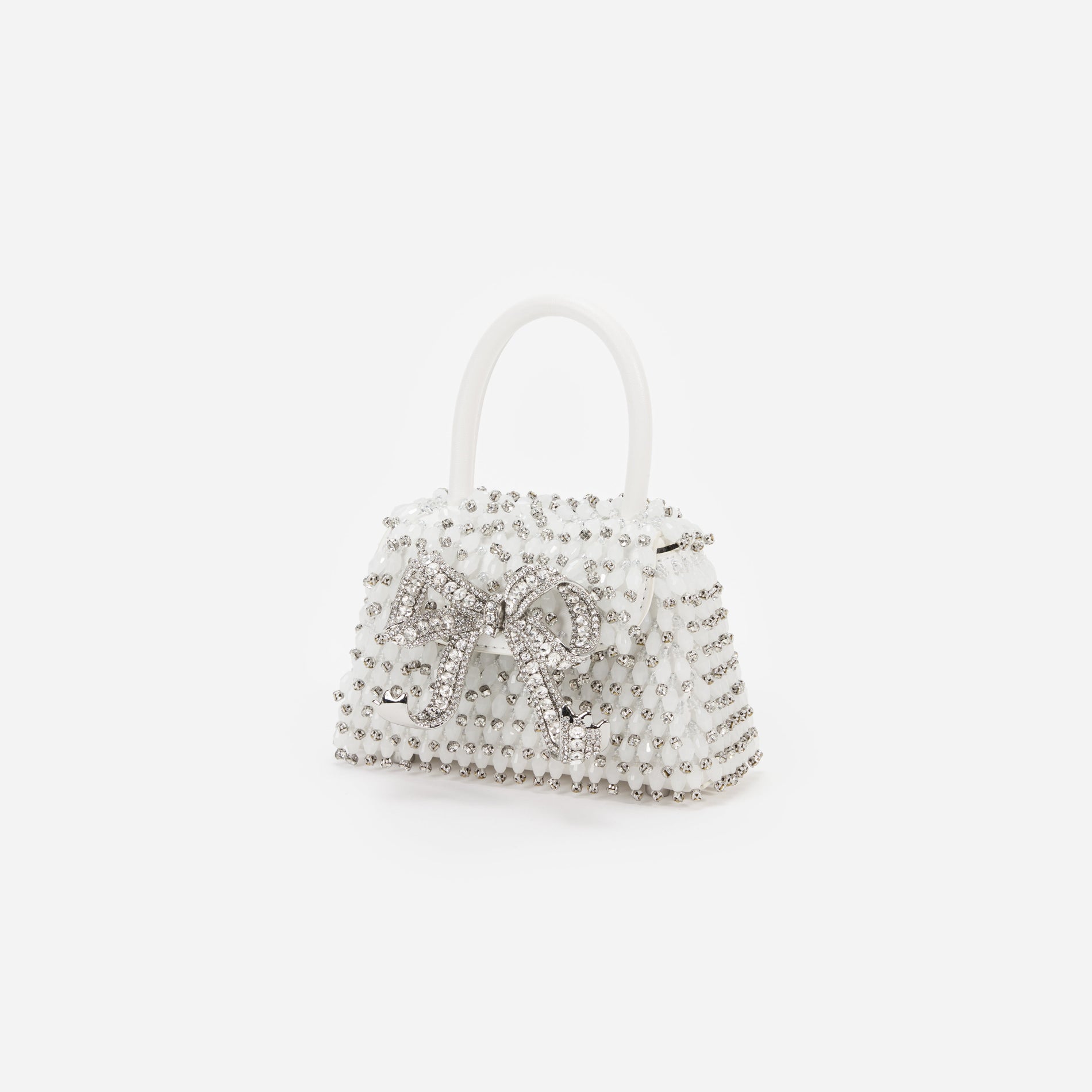 Side view of a woman wearing the White Embellished Micro Bow Bag