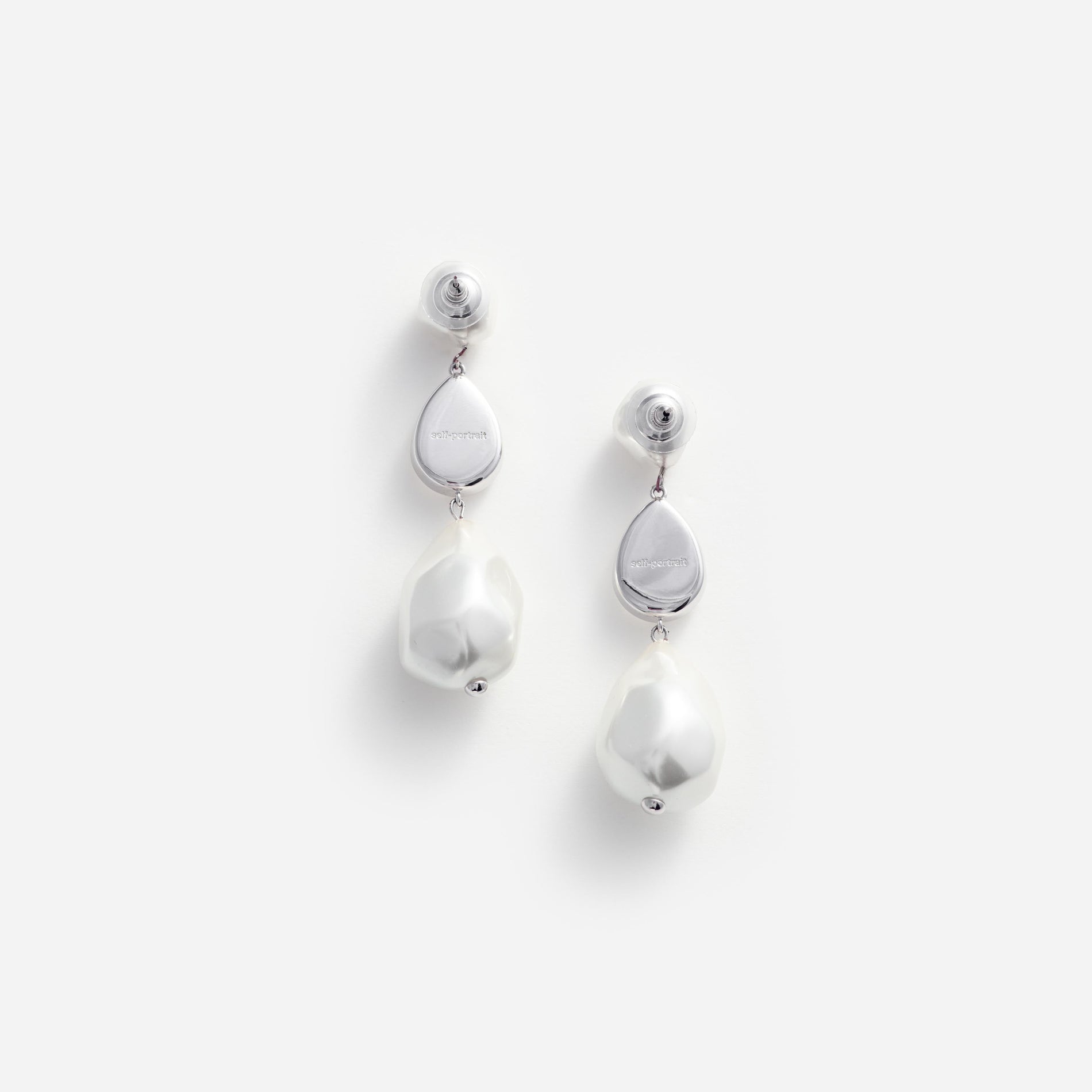 Side view of a woman wearing the Pearl Crystal Droplet Earrings