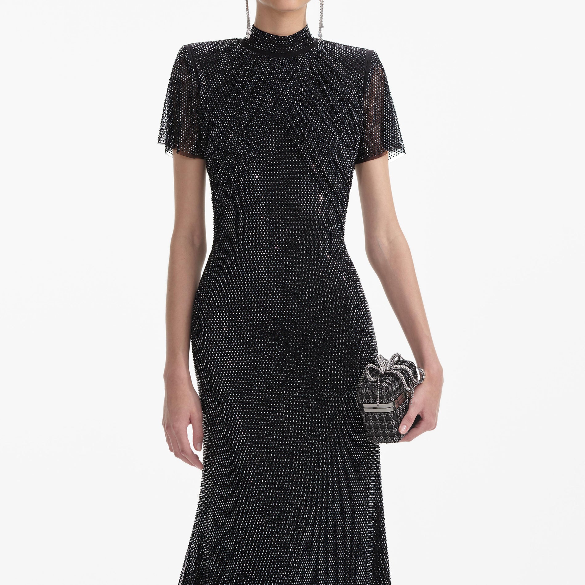 A close up of a woman wearing the Black Rhinestone Mesh Midi Dress