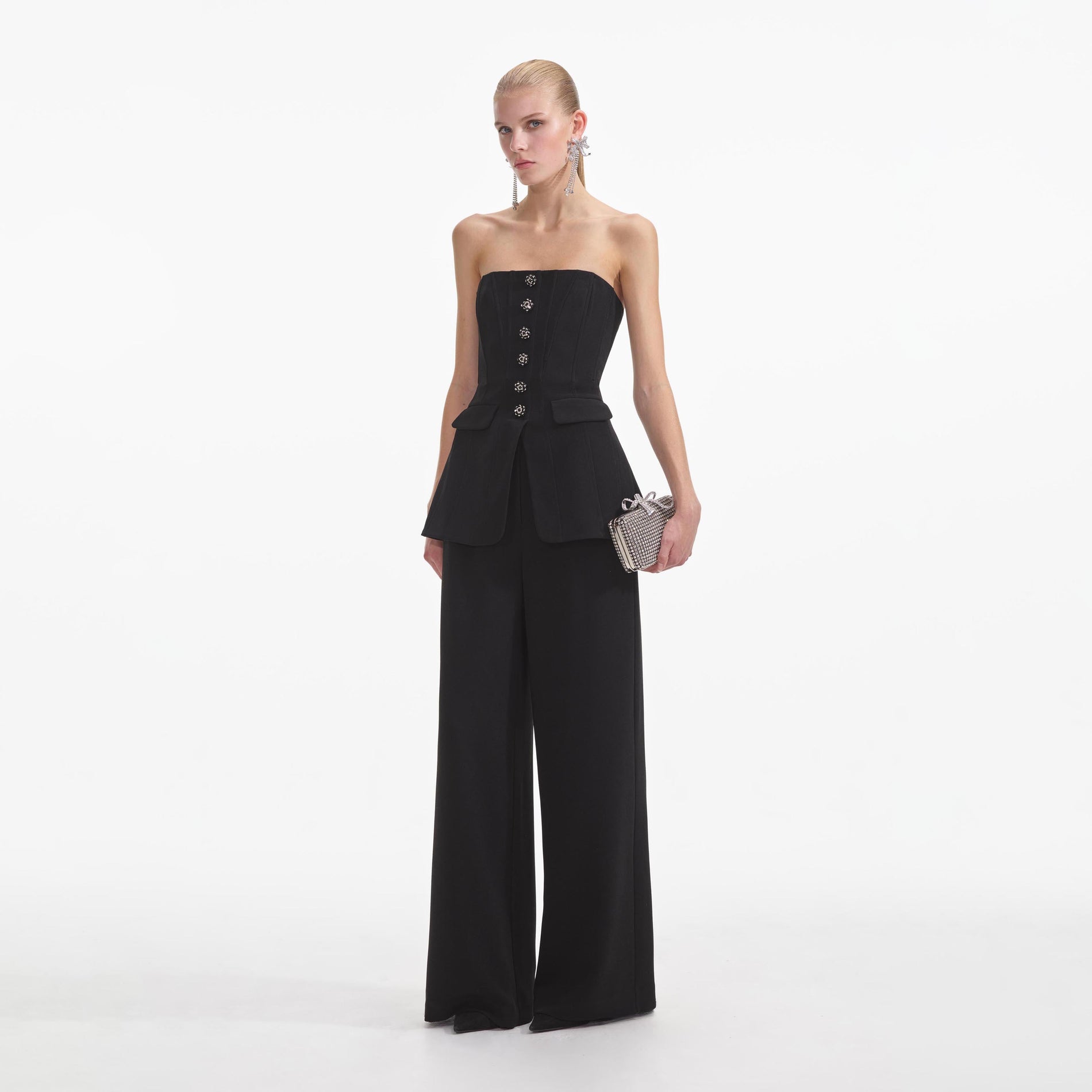 Side view of a woman wearing the Black Bandeau Crepe Jumpsuit