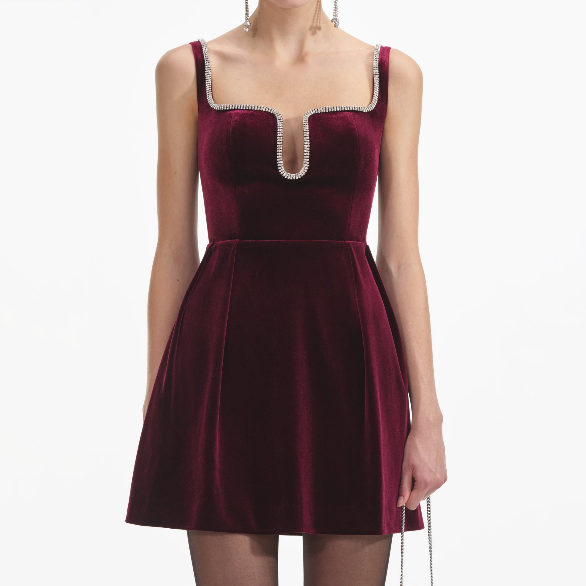 A close up of a woman wearing the Burgundy Velvet Mini Dress