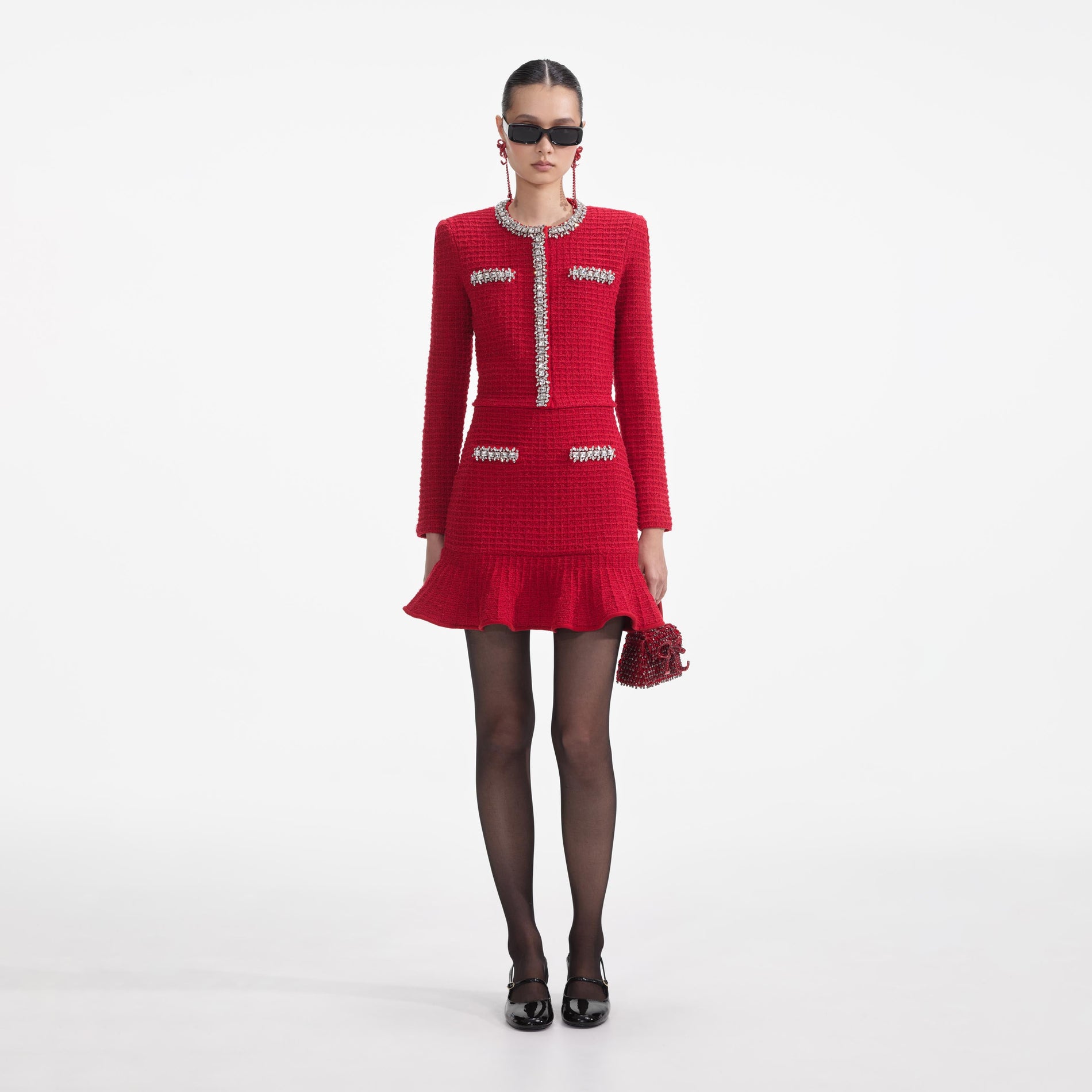 Front view of a woman wearing the Red Textured Knit Mini Skirt