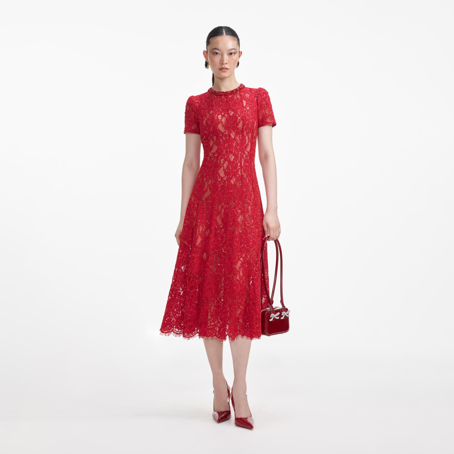 Front view of a woman wearing the Red Sequin Lace Midi Dress