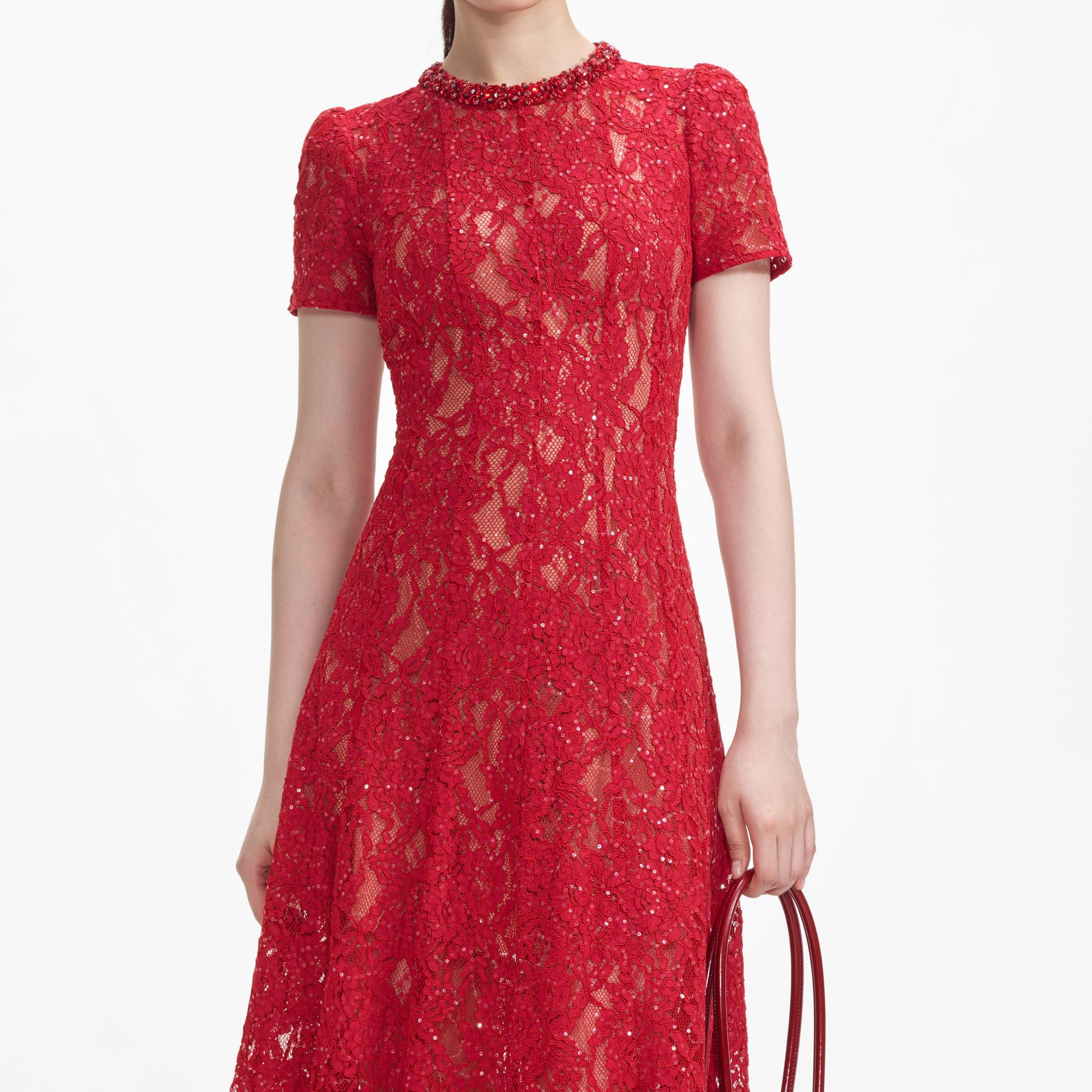A close up of a woman wearing the Red Sequin Lace Midi Dress