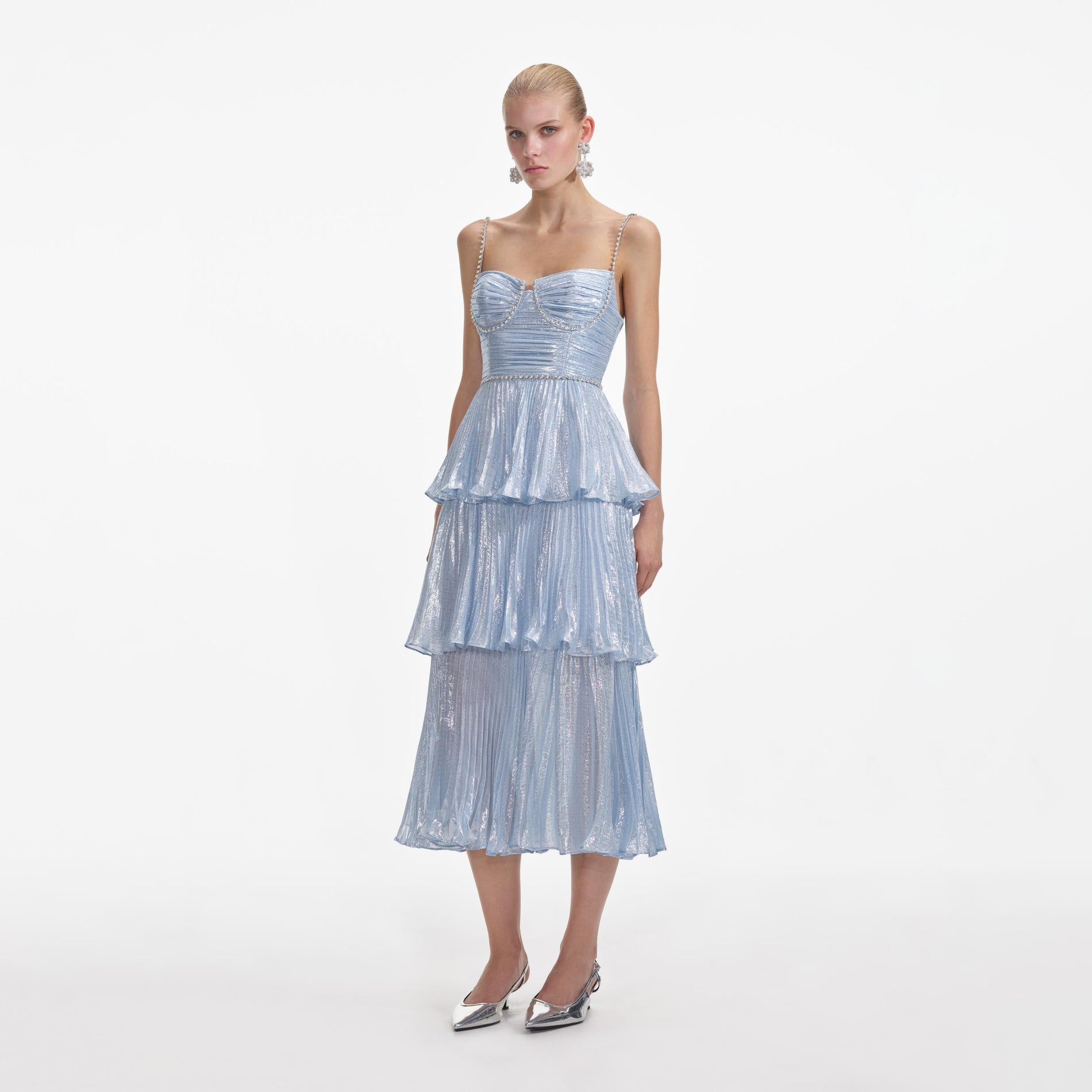 Side view of a woman wearing the Blue Metallic Tiered Midi Dress