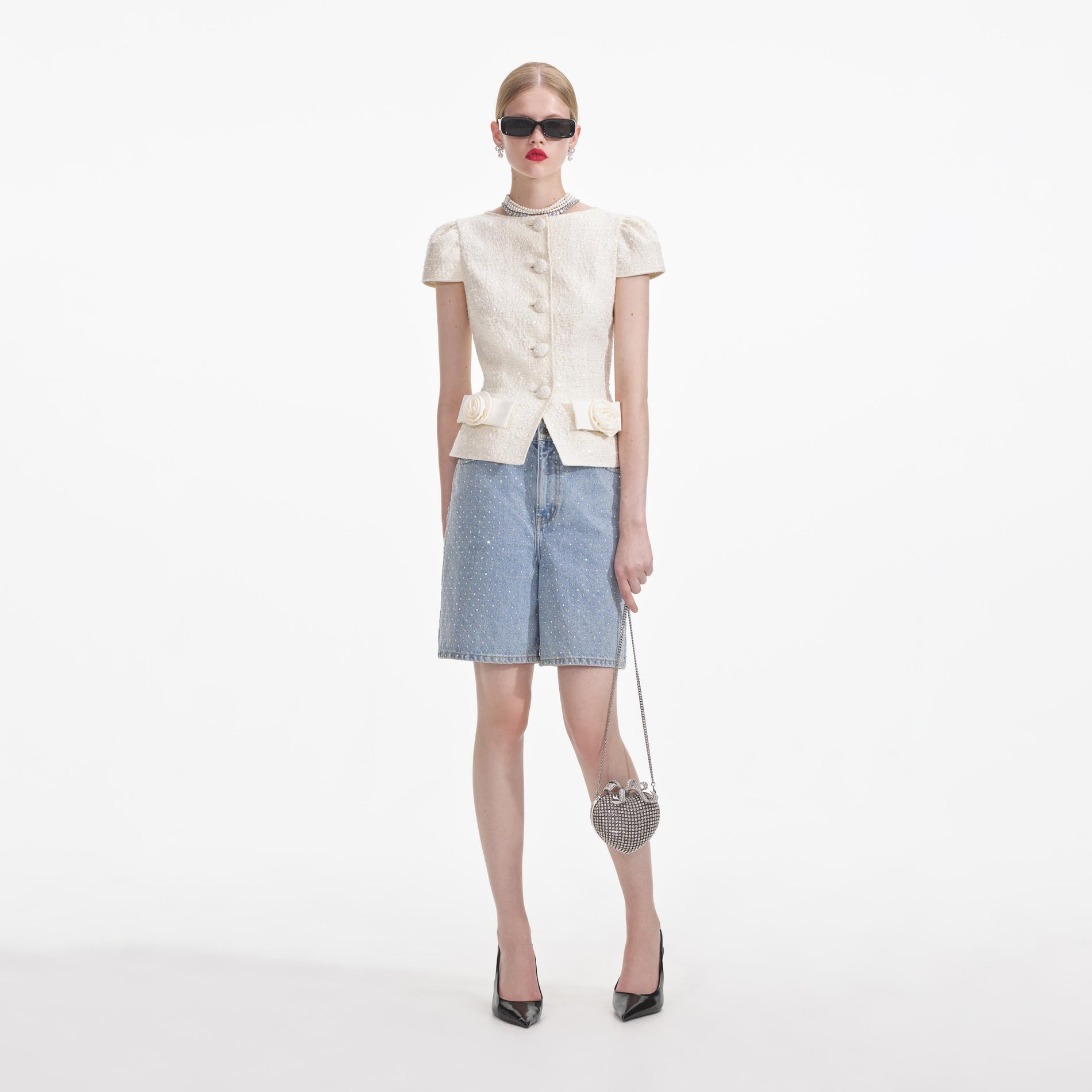 Back view of a woman wearing the Cream Boucle Bow Detail Top