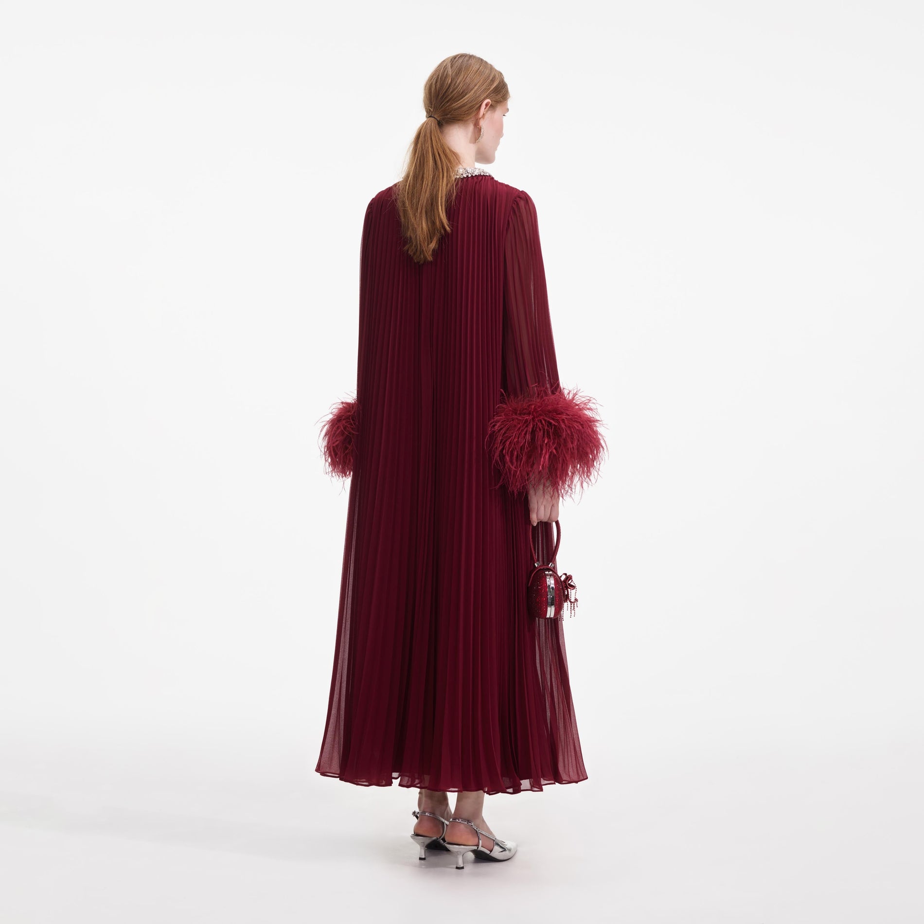 Back view of a woman wearing the Burgundy Chiffon Feather Midi Dress