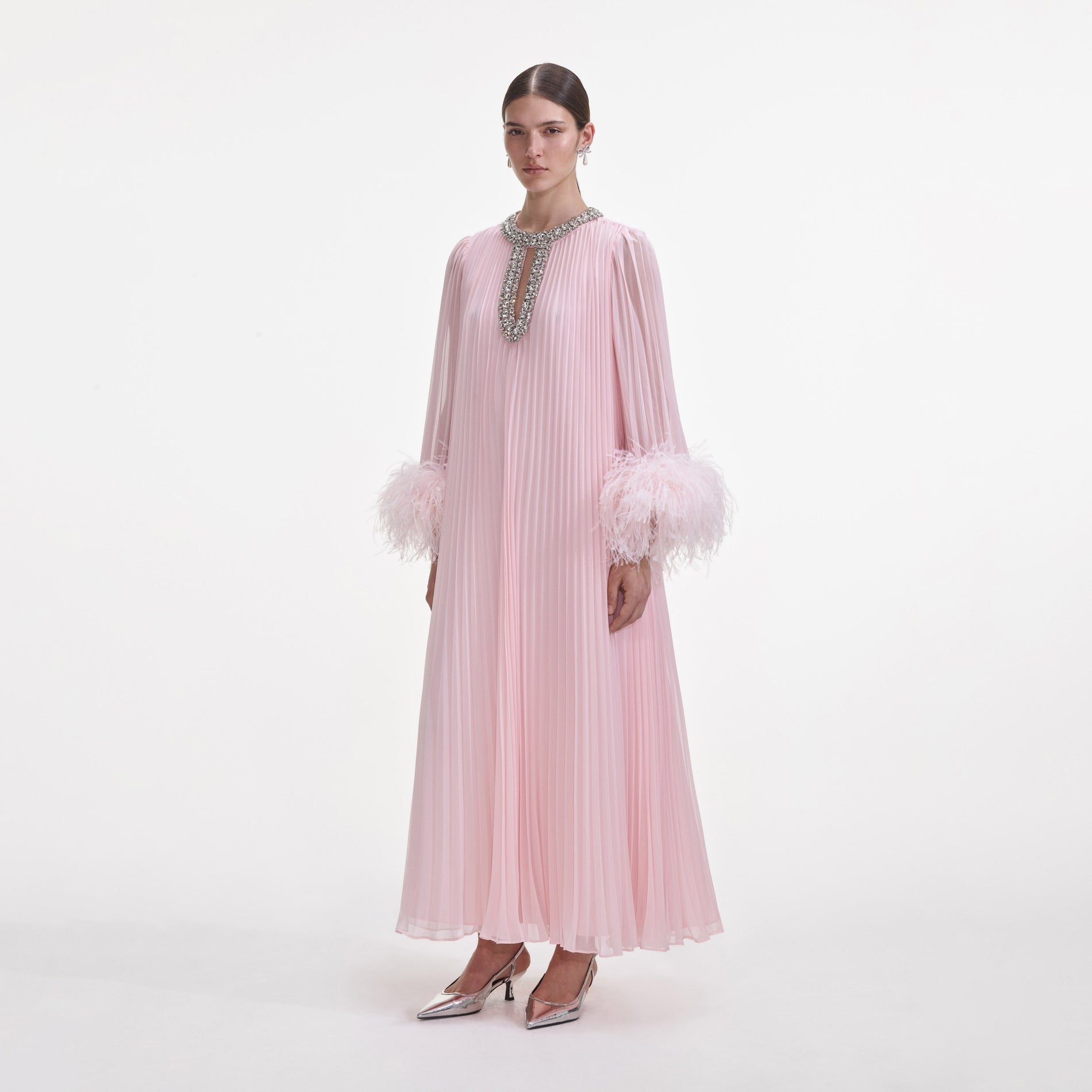 Side view of a woman wearing the Pink Chiffon Feather Midi Dress